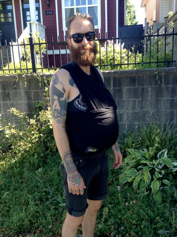 My brother baby-wearing his two-week-old baby.