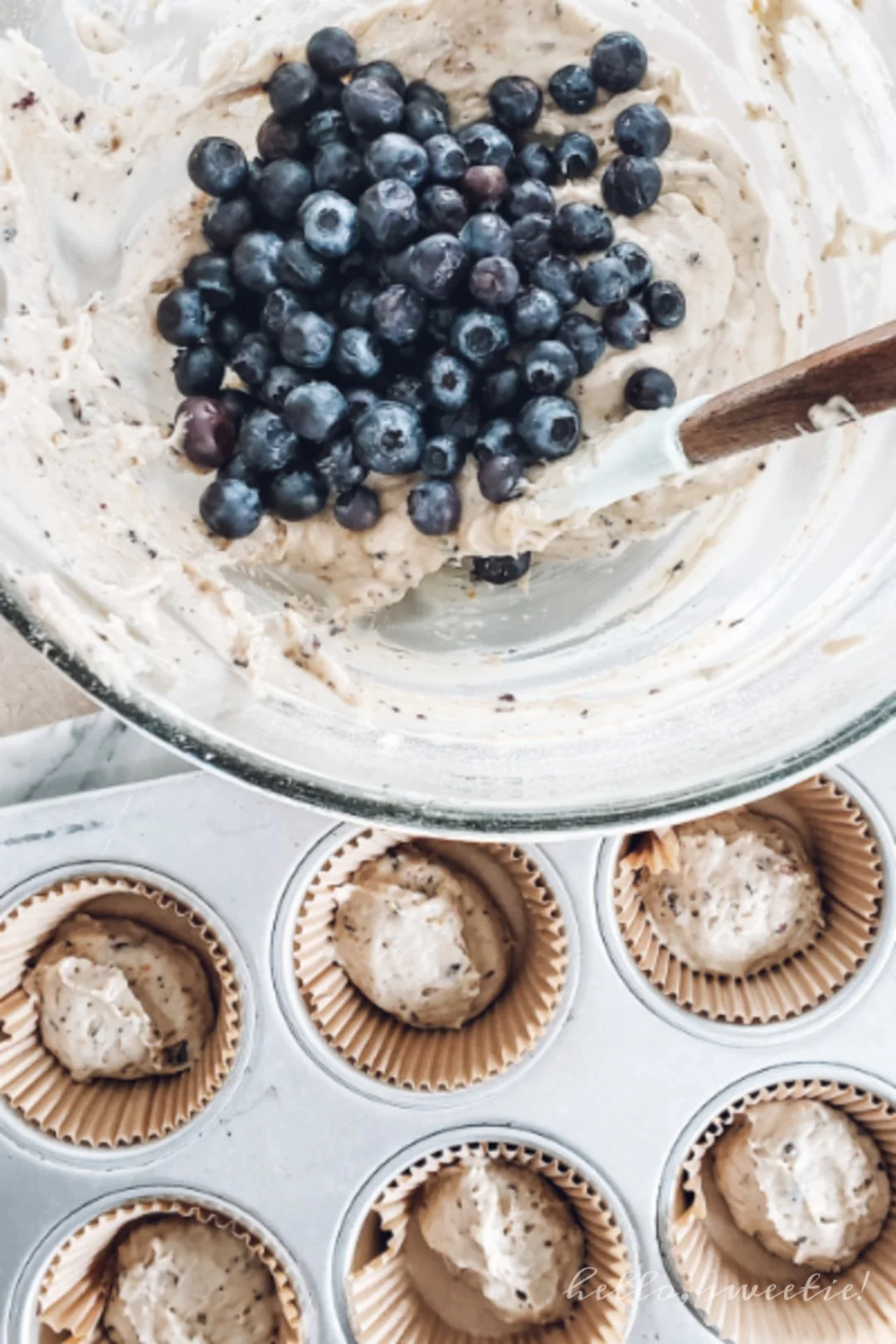 Gently fold the whole blueberries into the batter so they don't break open, making a purple muffin!