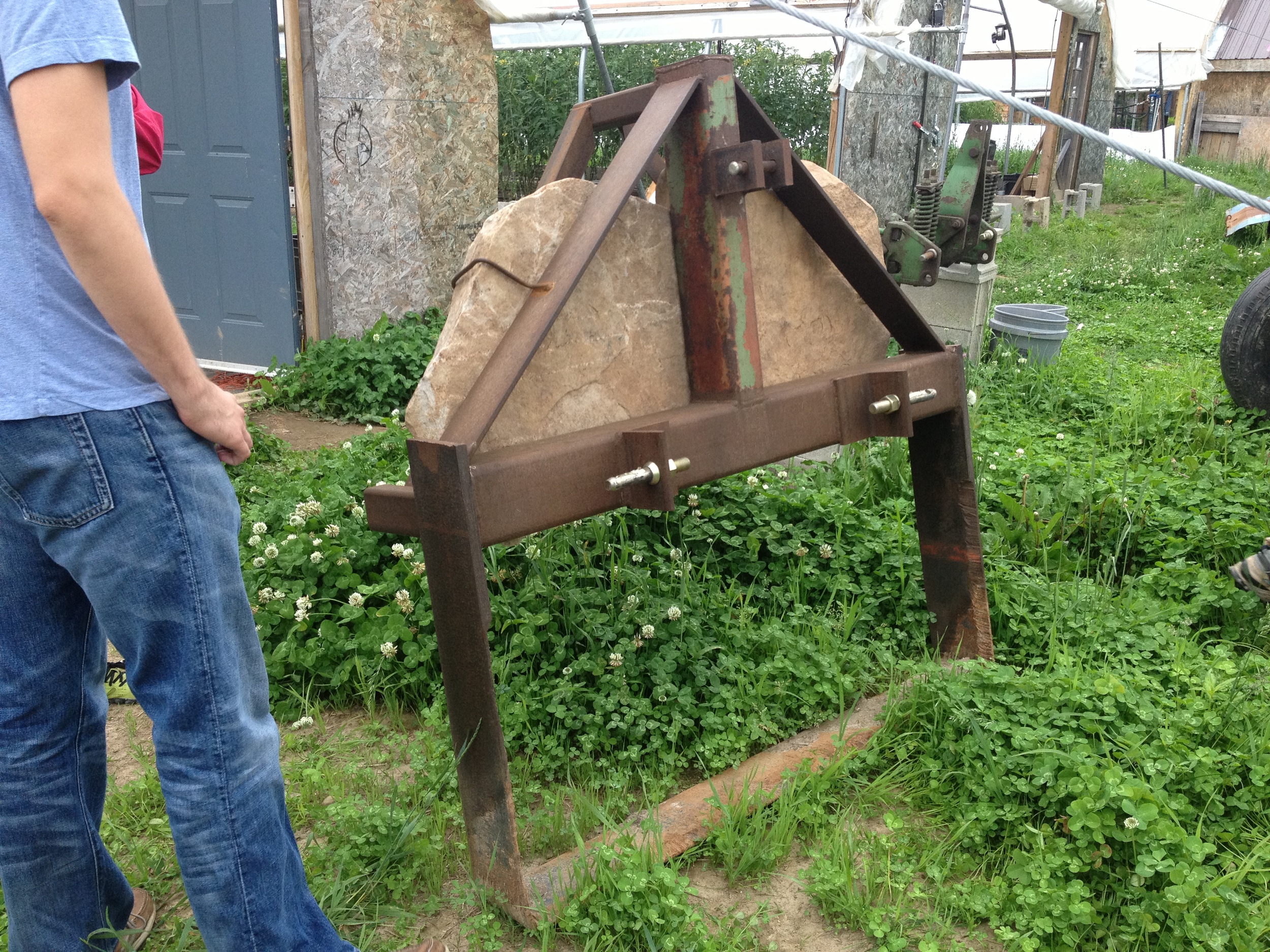  This is a nifty tool that the farm's mechanic Ryan made; it runs through a bed of carrots behind a tractor, lifting them up from below to loosen them, making harvest a breeze. 