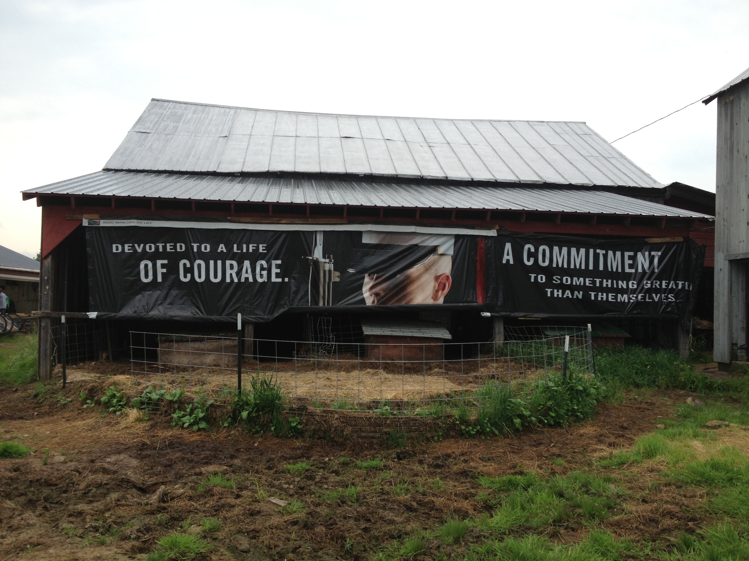  Another great example of creative recycling - a vinyl Marines banner provides some extra cover on an open-sided barn. 