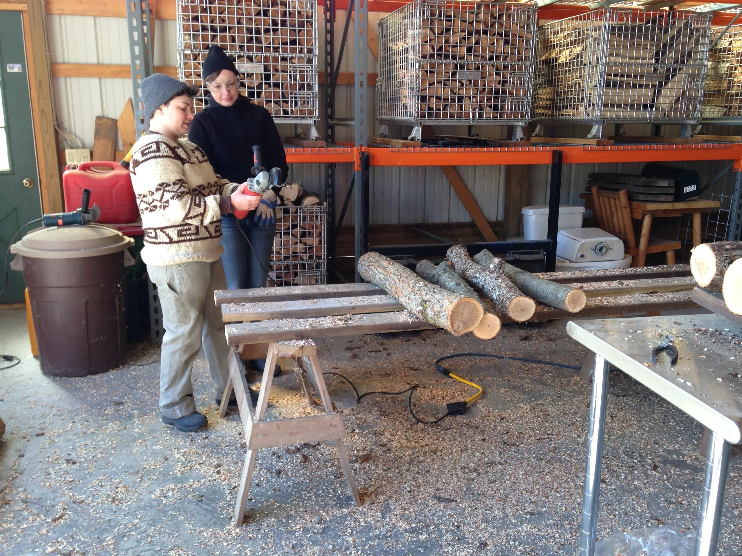 Showing Amanda how to use the angle grinder