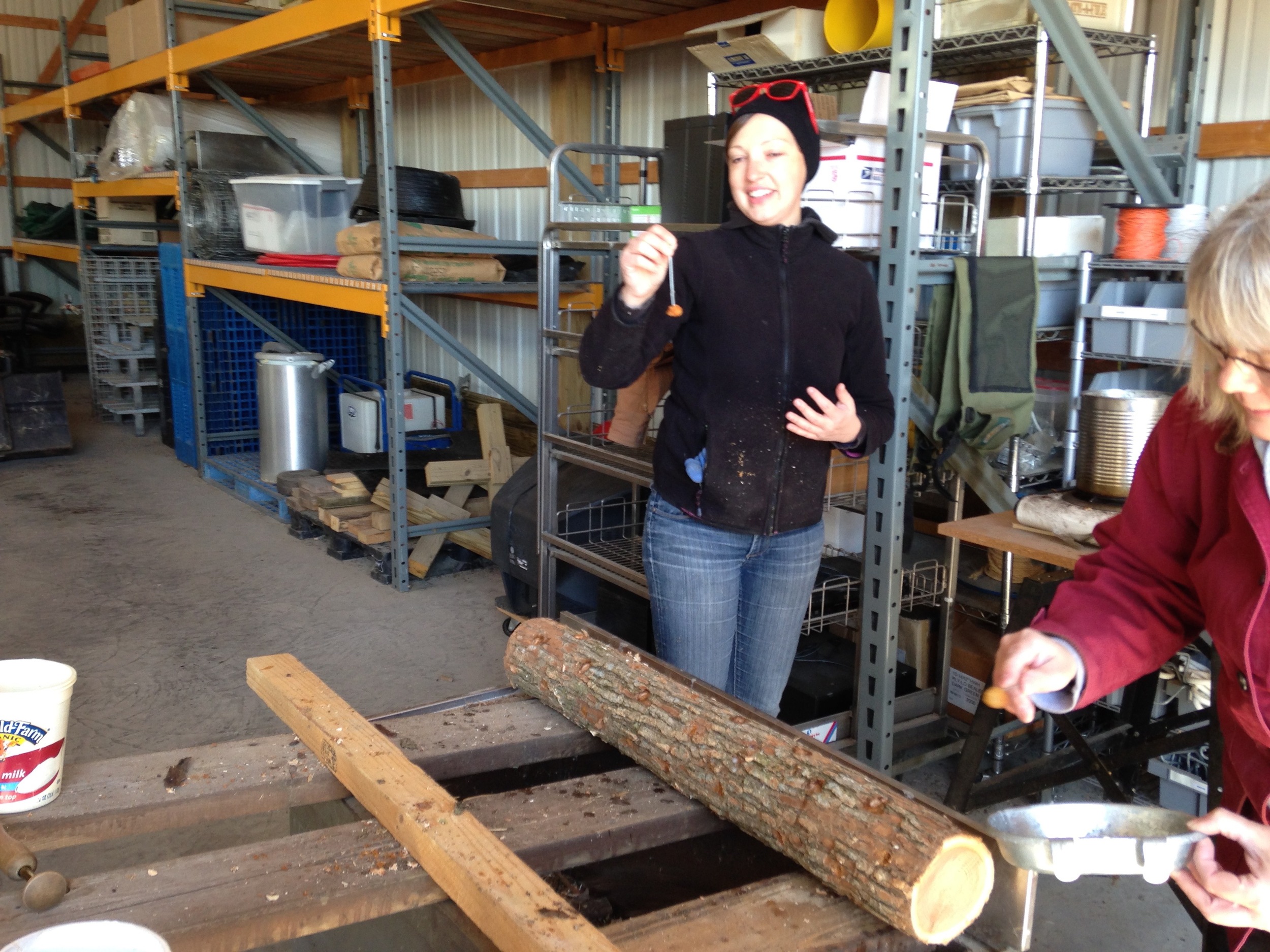  Emily and Amanda at the wax station, which doubles as quality control, making sure nobody misses a hole. 