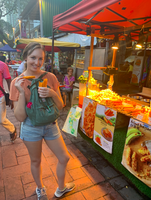 Me trying fried banana for the first time at the night market. Very delicious!
