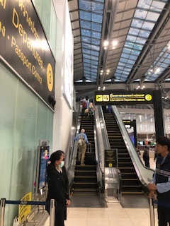Roy ascending the escalator, headed home from BKK airport!