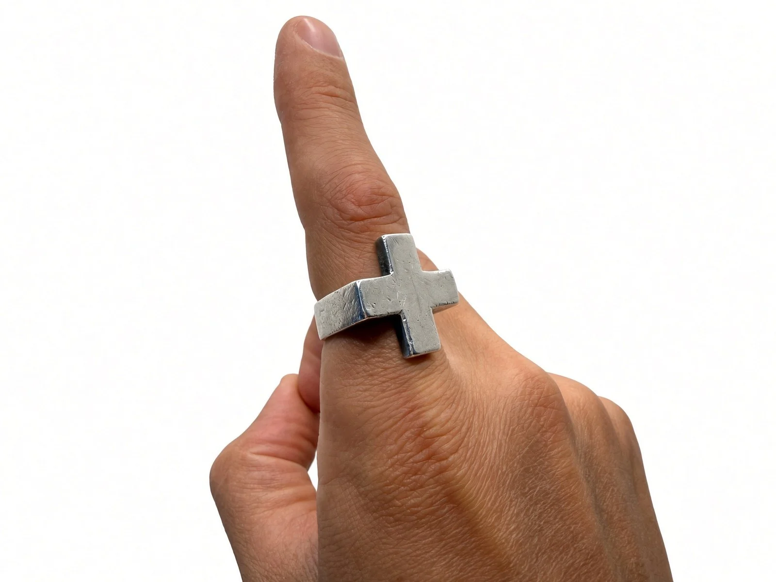 Sterling silver Plus Ring on a pointing index finger, white backdrop