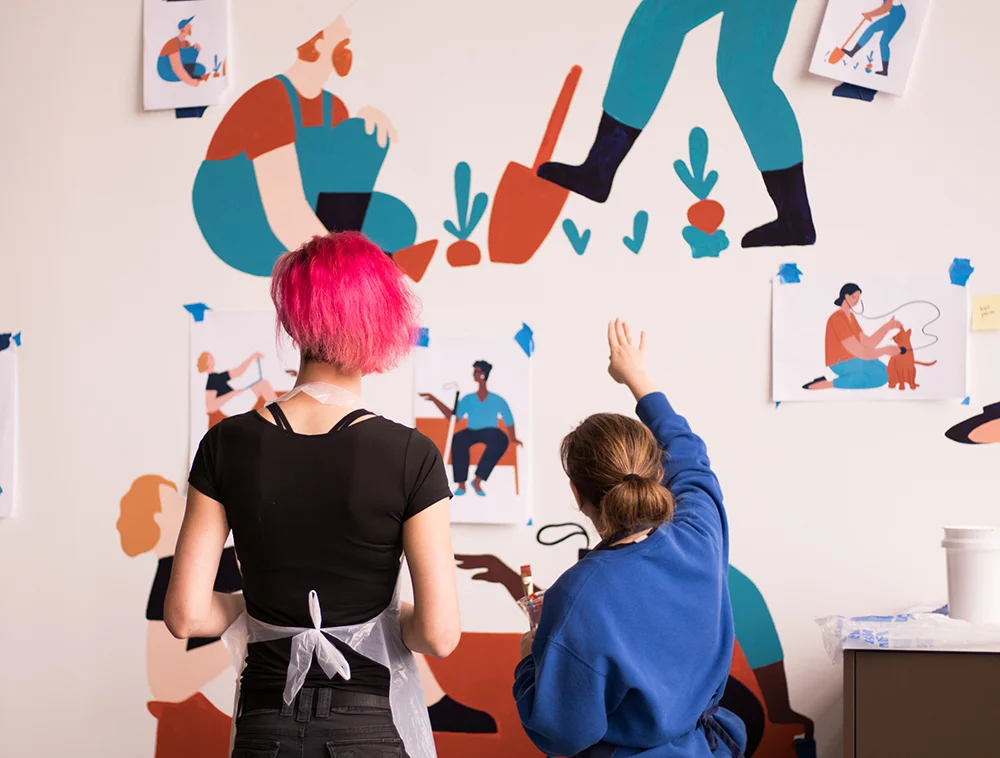We created a paint-by-numbers collaborative mural showcasing our customers. All Gusto employees were invited to help paint the mural during our first week in the office. The mural was illustrated by my talented teammate, Camellia Neri .