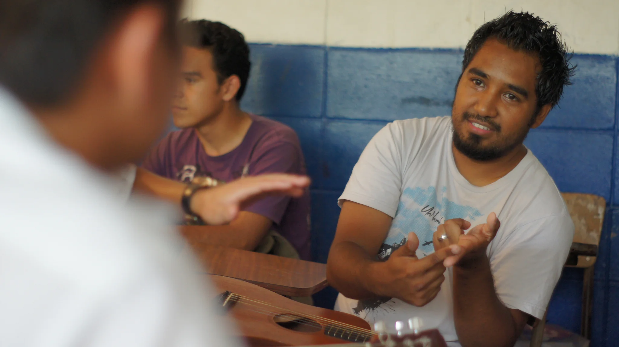 Rafael Reyes reviews the key principles of his music theory class with students. Rafael is a gifted musician, and has been involved with G.O.D. International since 2006. 