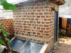 This is a view of the eco-toilet from the back and side. The structure was constructed with local materials.