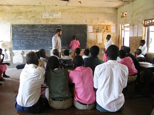 In this crowded Ugandan classroom where Corey Streeter taught English, only one skirt is visible. The WHO says that 20% of female students in East Africa will drop out before secondary school. 