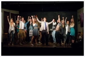 The cast of “It’s Elementary,” concludes one of their musical numbers.