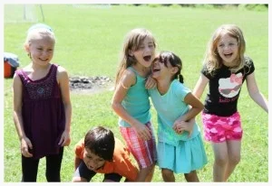 Moriah Olson, Justice Garner, Kiah Roufs, Luci Munoz and Esther Bargatze laugh hysterically during a drama lesson at Camp Kaibigan.