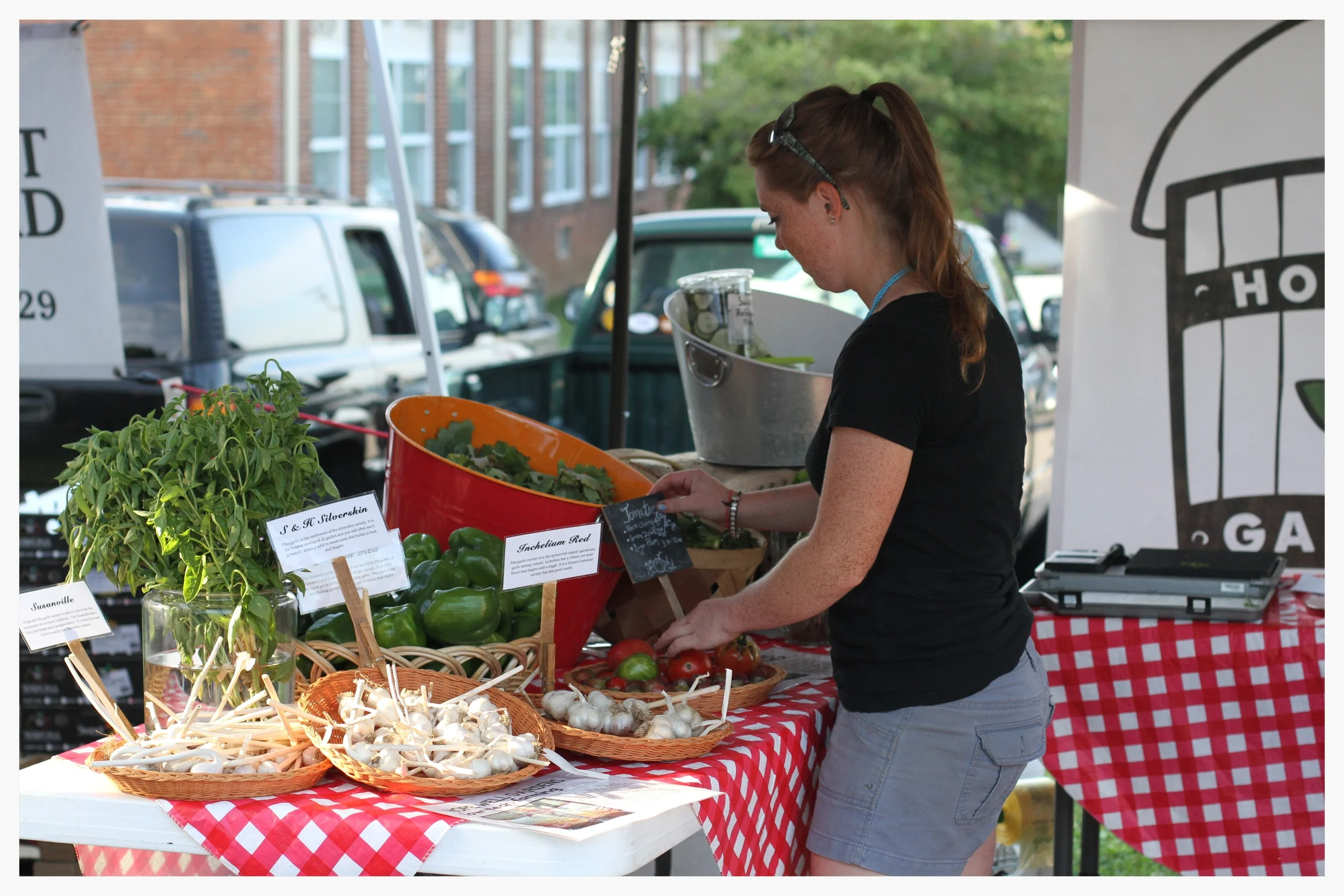 Bennecker arranges the food signs, which inform customers about the nutritional value of what they are buying, and different ways to prepare it.