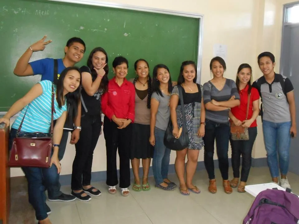 Rina and her classmates from Columban College celebrate after 4 years of hard work towards their Social Work degree.