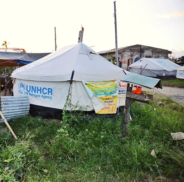 Lining the road are scenes like this–makeshift shelters out of the remains of former homes. We’ve discovered that the most damage, and loss, was experienced by the poor who were living in a) flood plains and b) inadequate shelters that just blew away.
