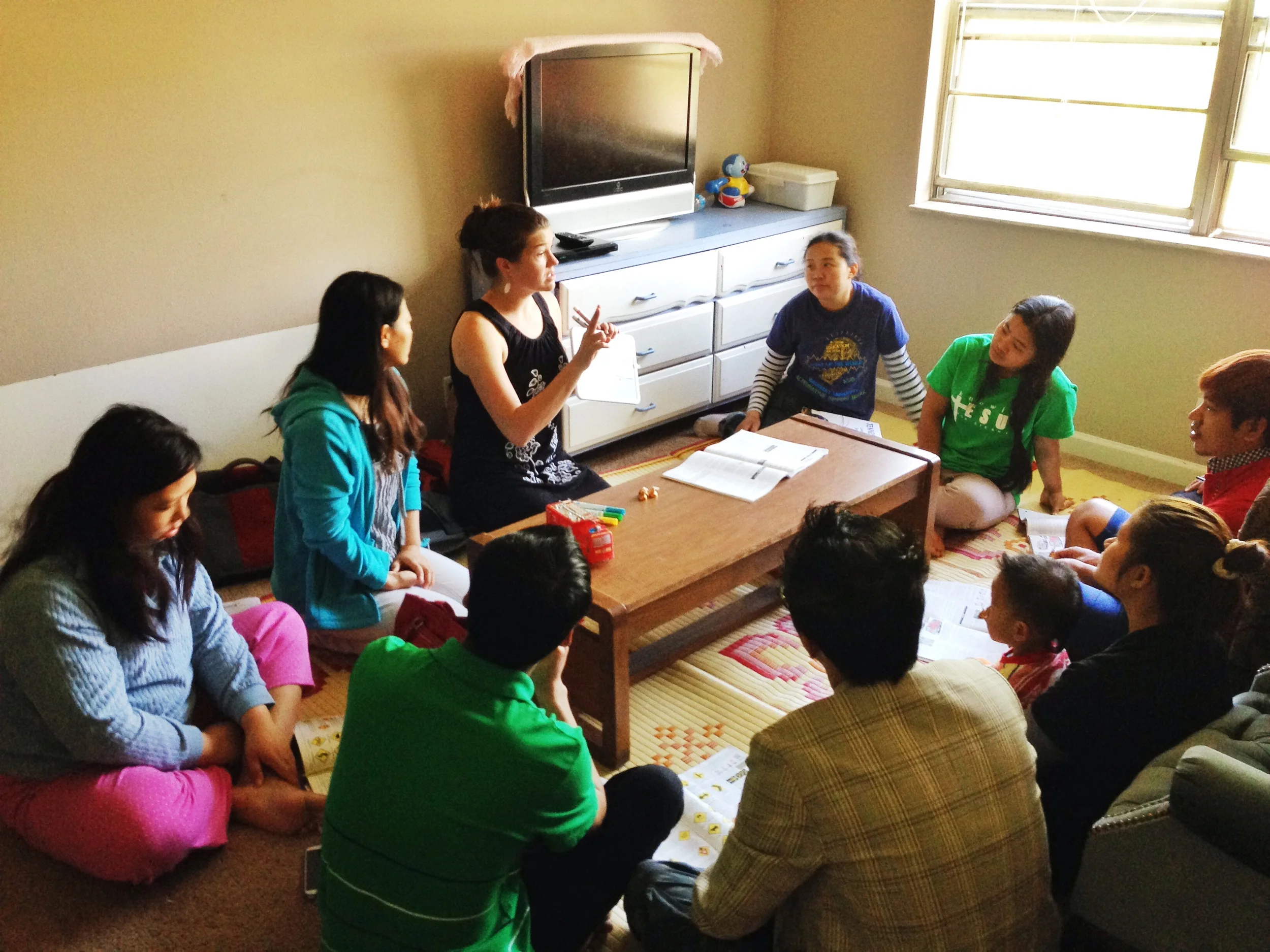 Rebekah Davis, with the help of a translator, teaches a group of Burmese refugees the basics of driving in America. Her class grew quickly in size, due to the desperate need for this kind of education in their community. 