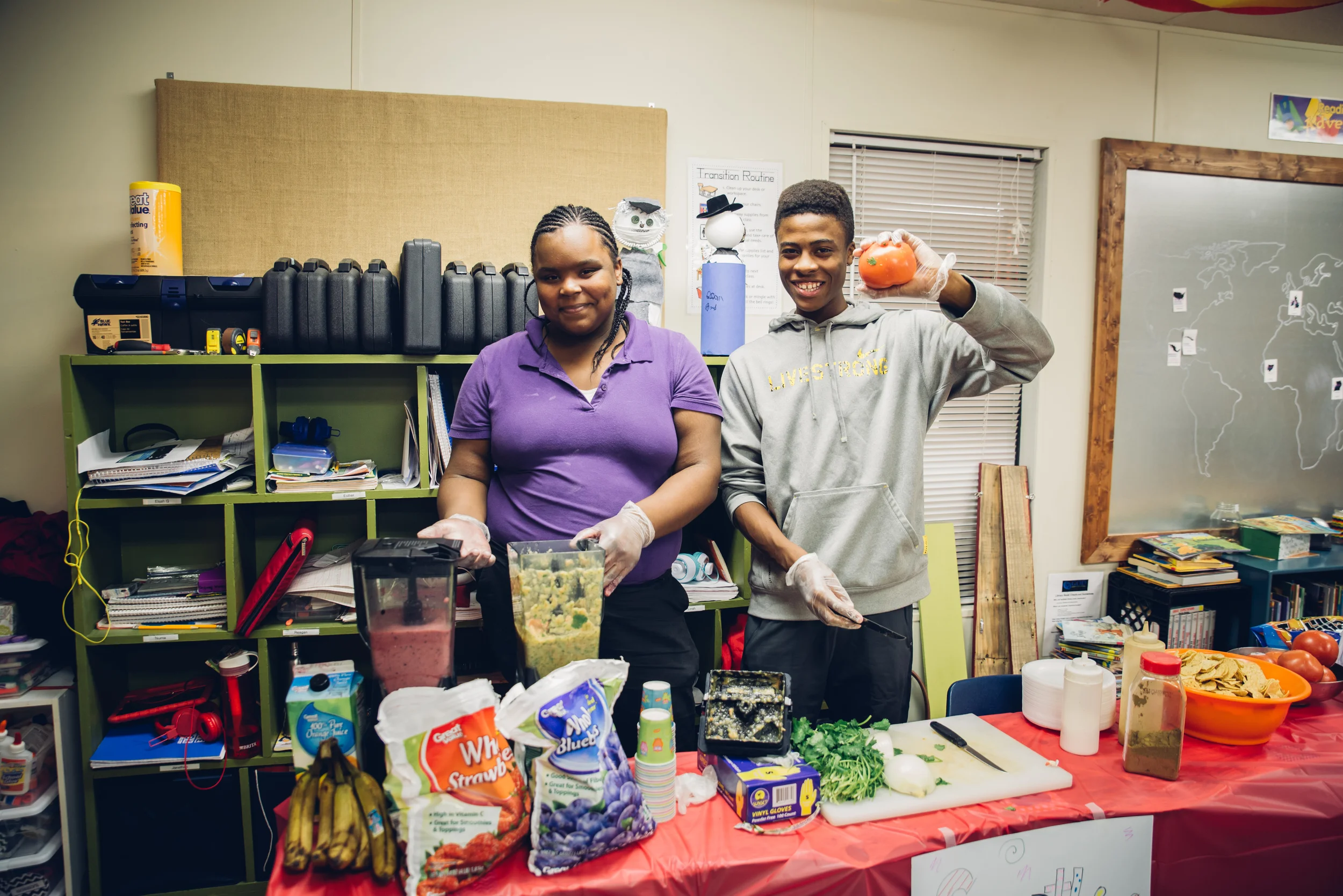 Yasmin and Gerron proudly display their homemade smoothies and salsa which they served their families and friends who came to "ShowCASE." 