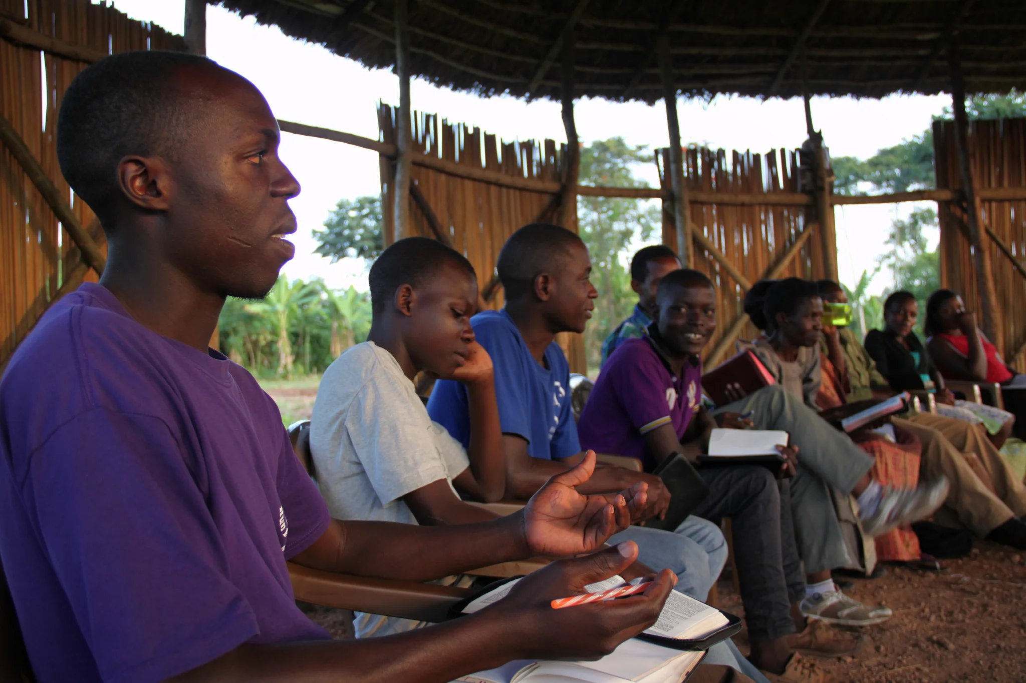 The college students also gather weekly for a community bible study. Here, Henry Milo raises a question regarding the text studied that week. 