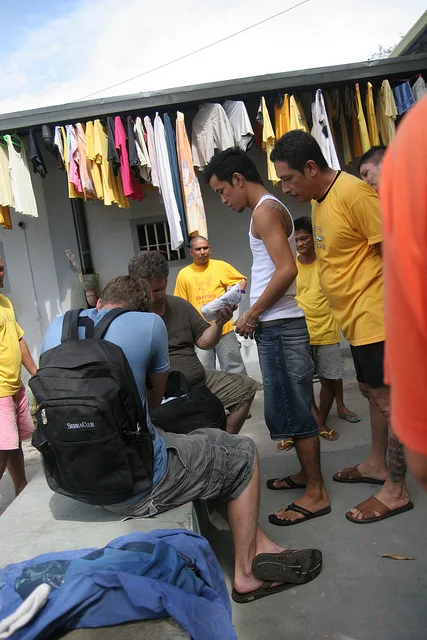 Mike Garner and Chris Cameron distribute basic necessities to inmates in another prison in the Philippines. Often, inmates don't have clean undergarments, toothbrushes, or blankets. Our representatives in the Philippines have consistently met needs like these for prisoners. 