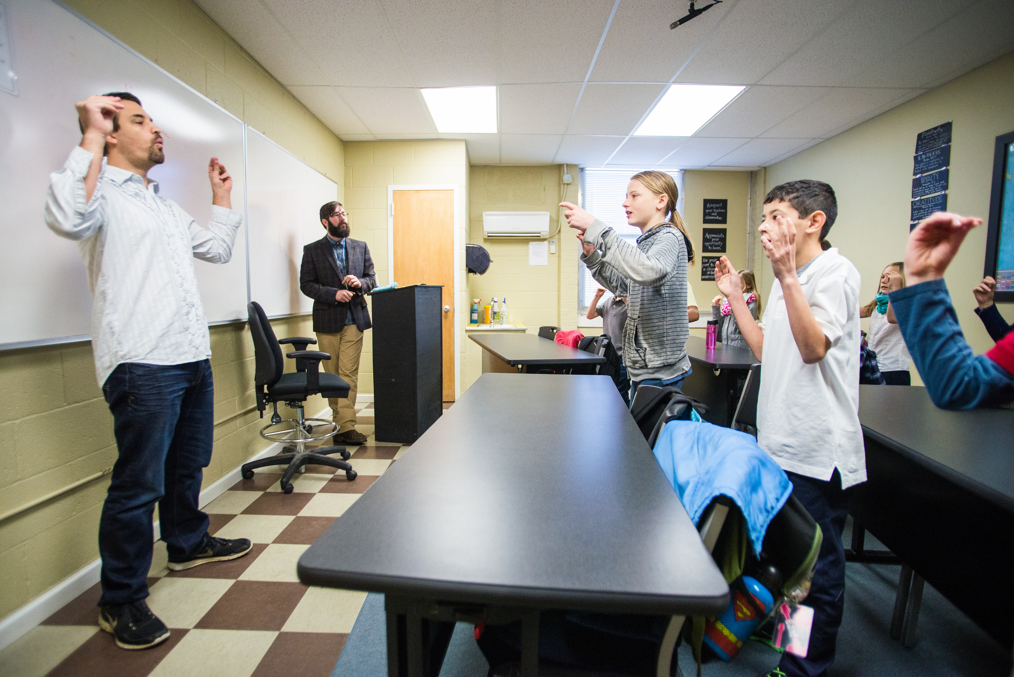 During an icebreaker game, Mr. Davis and Mr. Maute used a snapping, clapping game to get the students to follow specific instructions, listen, and obey. 