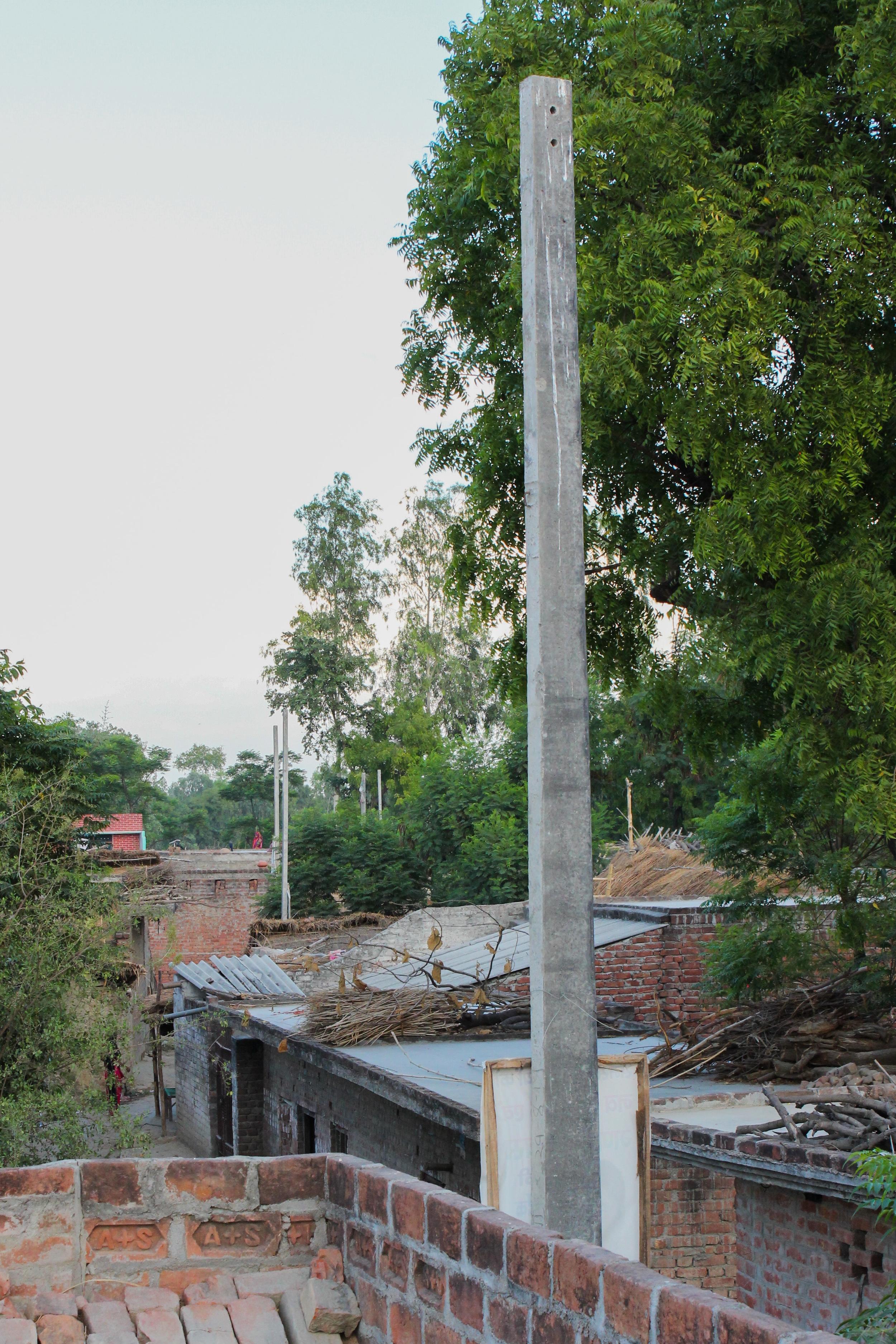 These concrete poles were set by the government to give light service to the village. They have no wires in them at all, and have been empty for over half a year, when they were installed. This means that the faulty solar panels are the only source of electricity for this village.