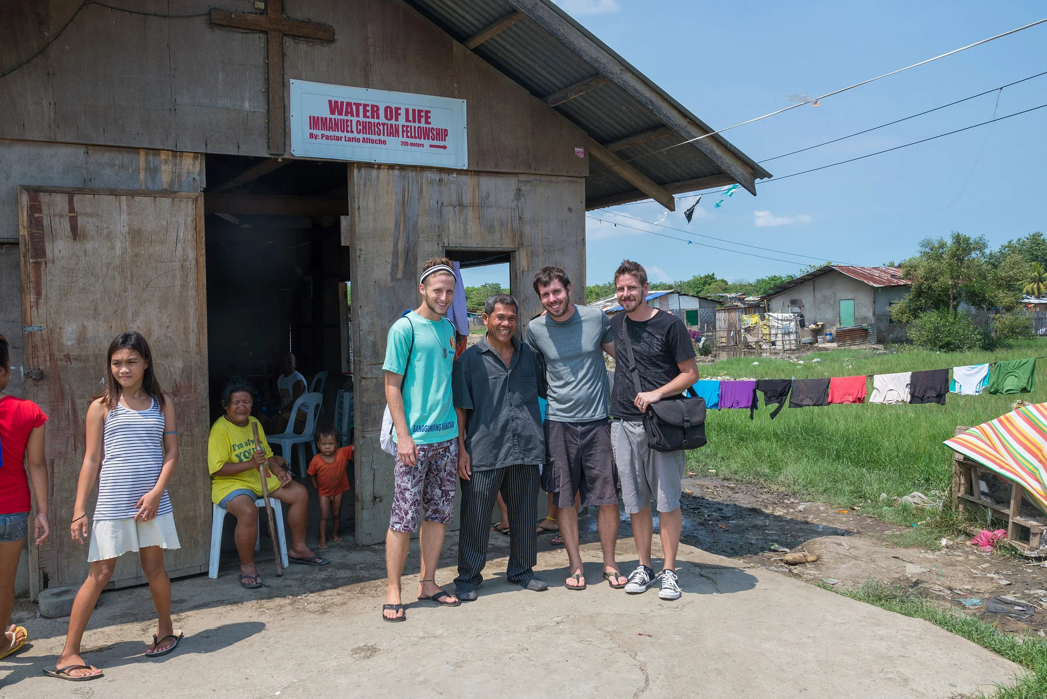 Chris Cameron (right) visiting a church in the Philippines alongside his brother Nate, and full-time development worker, Clark Miller. 