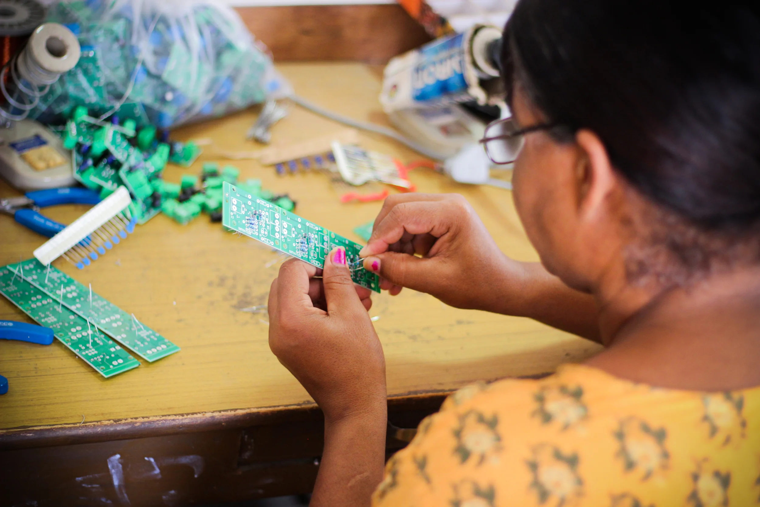 Stationed around stacks of circuit boards and transistors, these grandmothers spend six months learning the intricacies of solar engineering. Education at the College is practical rather than conceptual. These women may not be able to communicate the science behind a circuit board, but they are fully capable of soldering components and troubleshooting faulty systems.