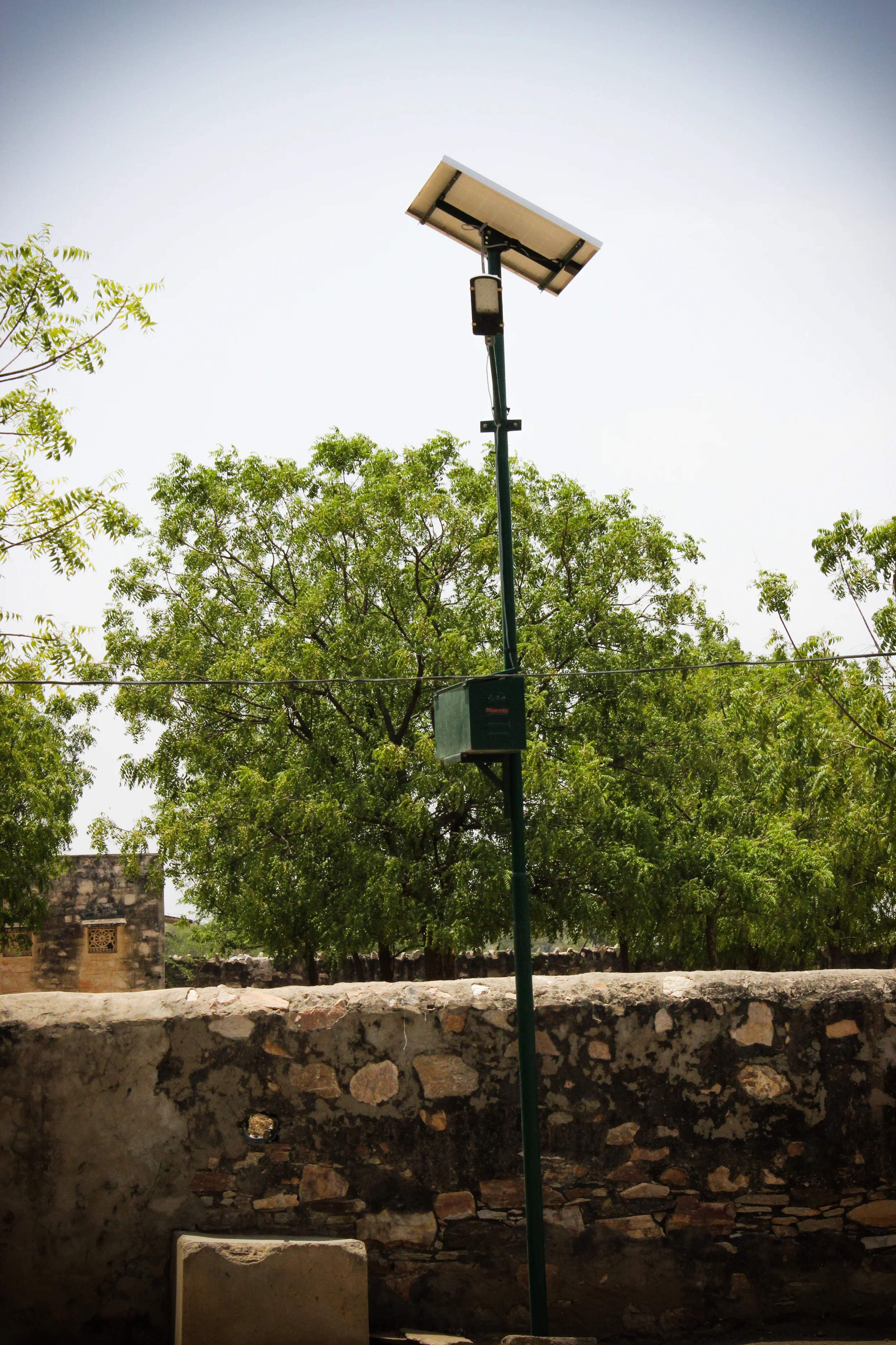 Solar systems have the potential to greatly improve the environment of poor communities. This simple street light provides light to dark neighborhoods, allowing families to safely and securely travel between homes and stores at night.