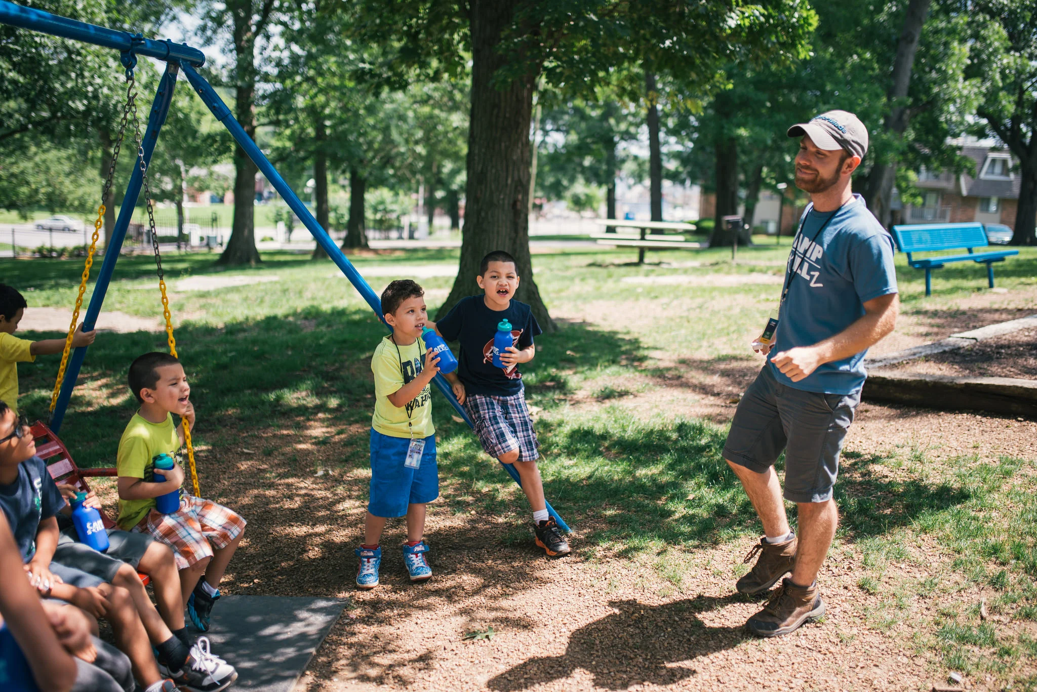 Zach Hartnell was one of our devoted Camp Skillz counselors. Below, he guides students in making their own guitars out of wooden cigar boxes, wood, and strings. 