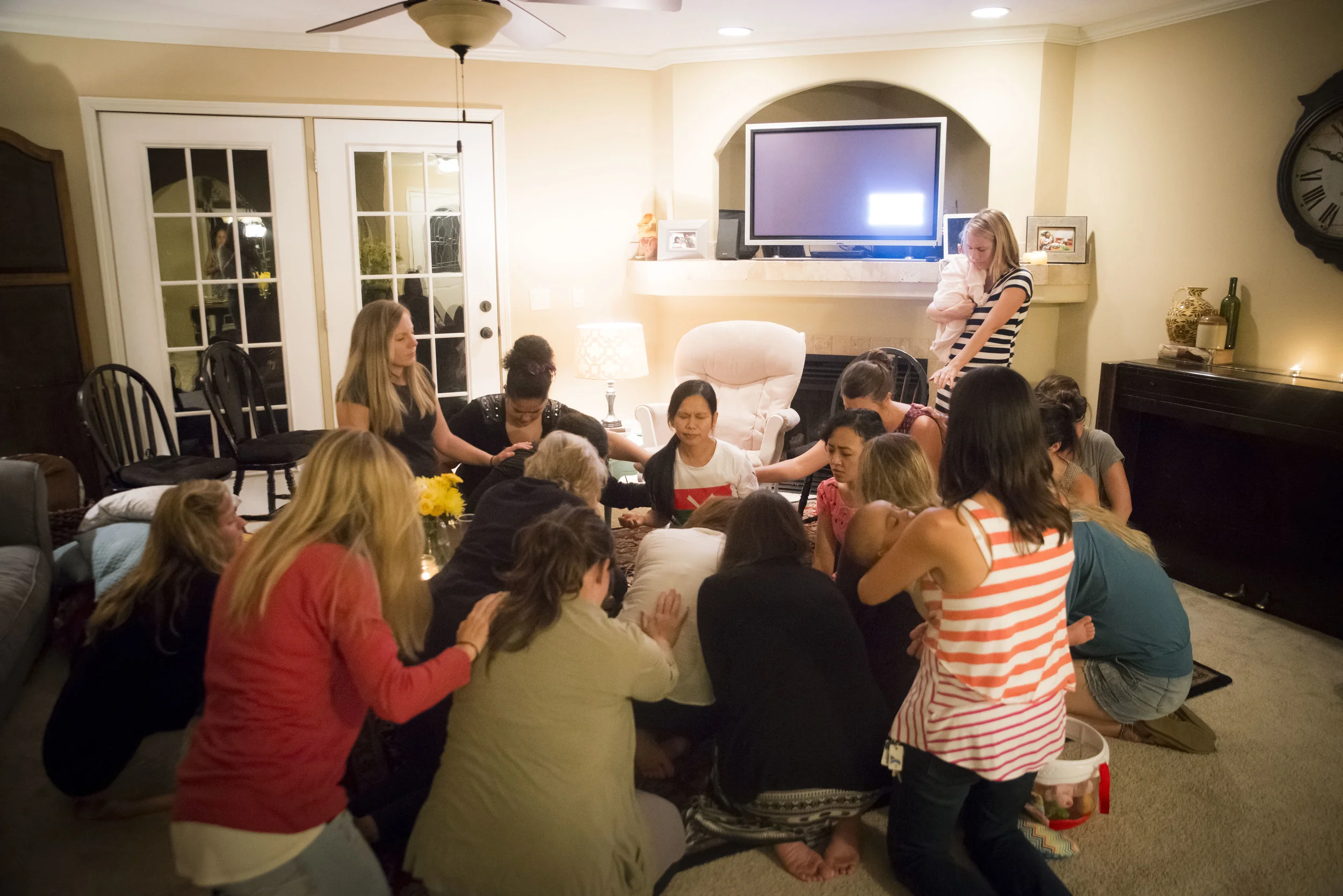 Women gather in prayer after the refugees shared their stories. It was a powerful time for all of the women involved. 