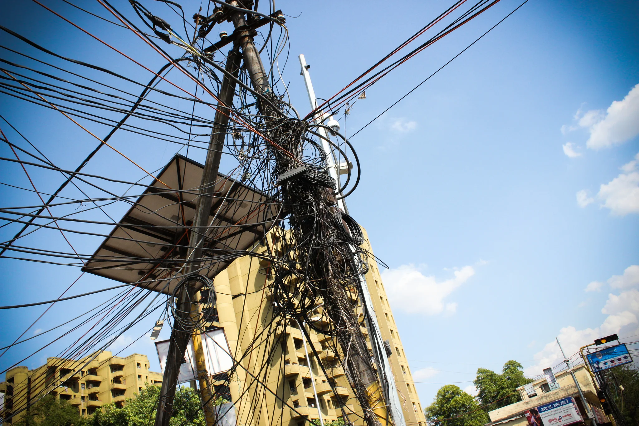 This web of electrical wires poses danger to the surrounding village, but is a common sight in India. 
