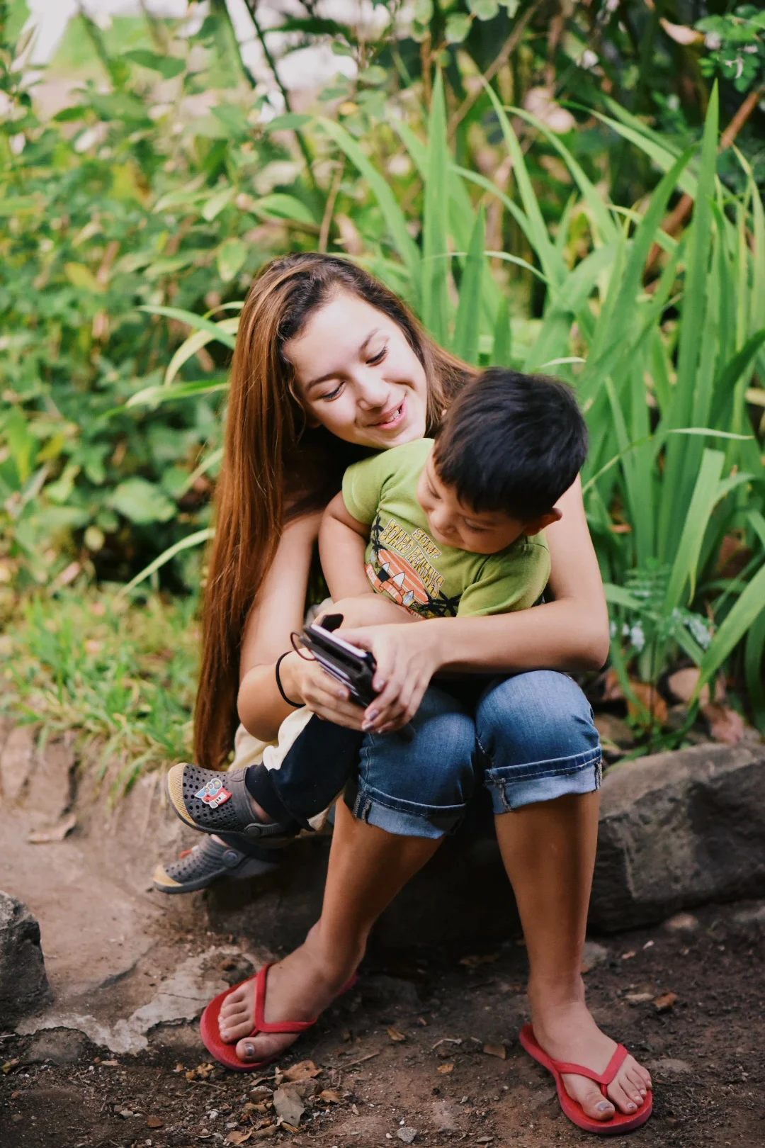 Genesis, the big sister of not only 3 younger siblings but a community of children, is a loving and skilled nurturer. 