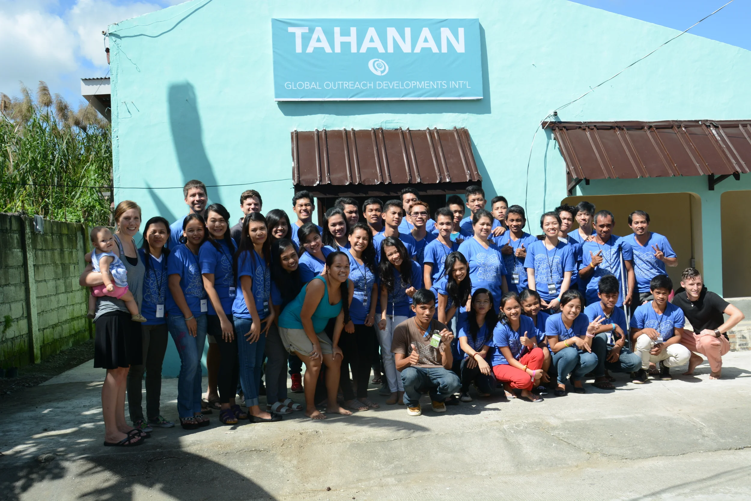 Our 2015 Bible Conference participants in front of our new, renovated Community Center in Tacloban!