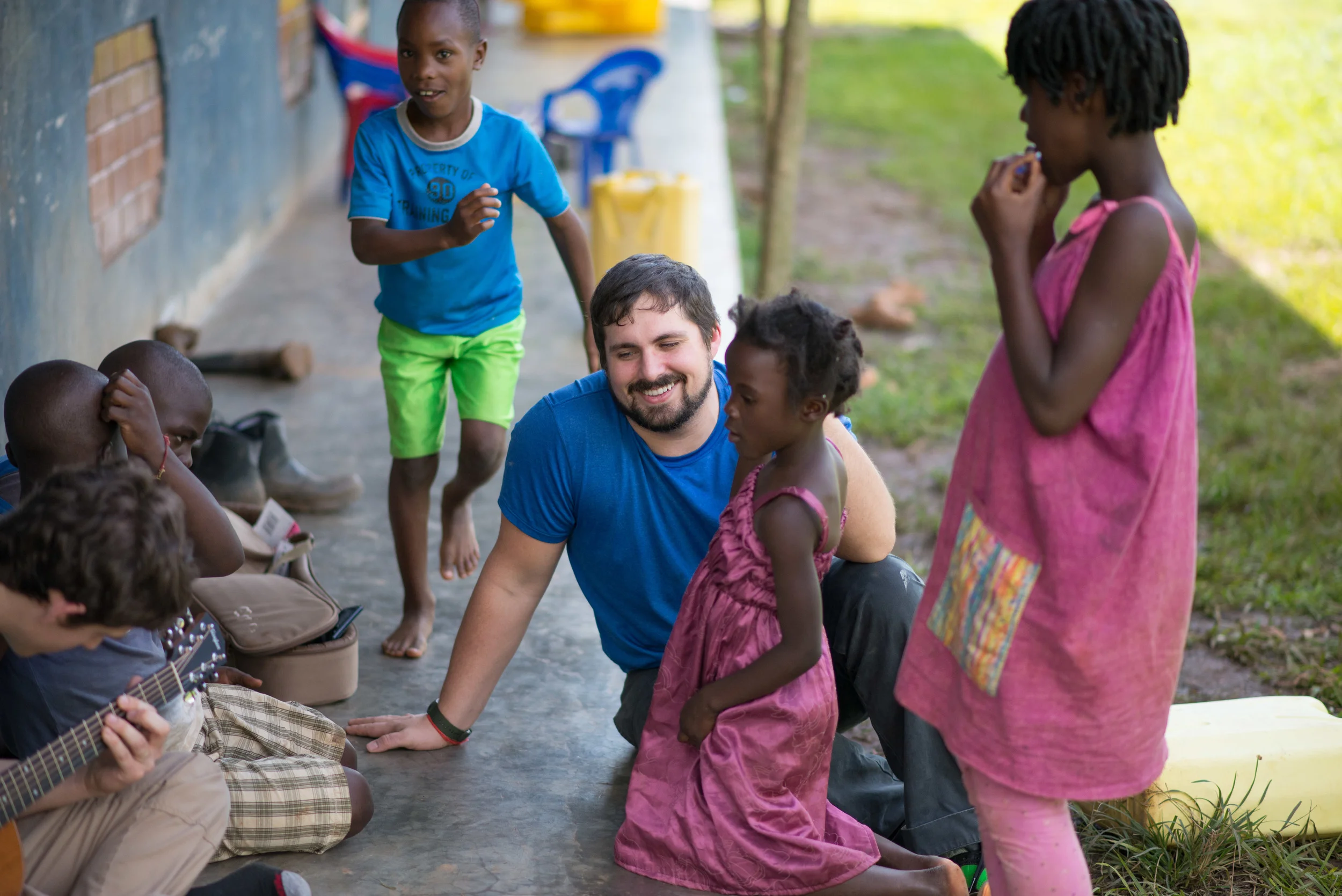 Matt James and Nick Moore, Institute for G.O.D. students and immersion team participants, leading the children songs in the afternoon. 