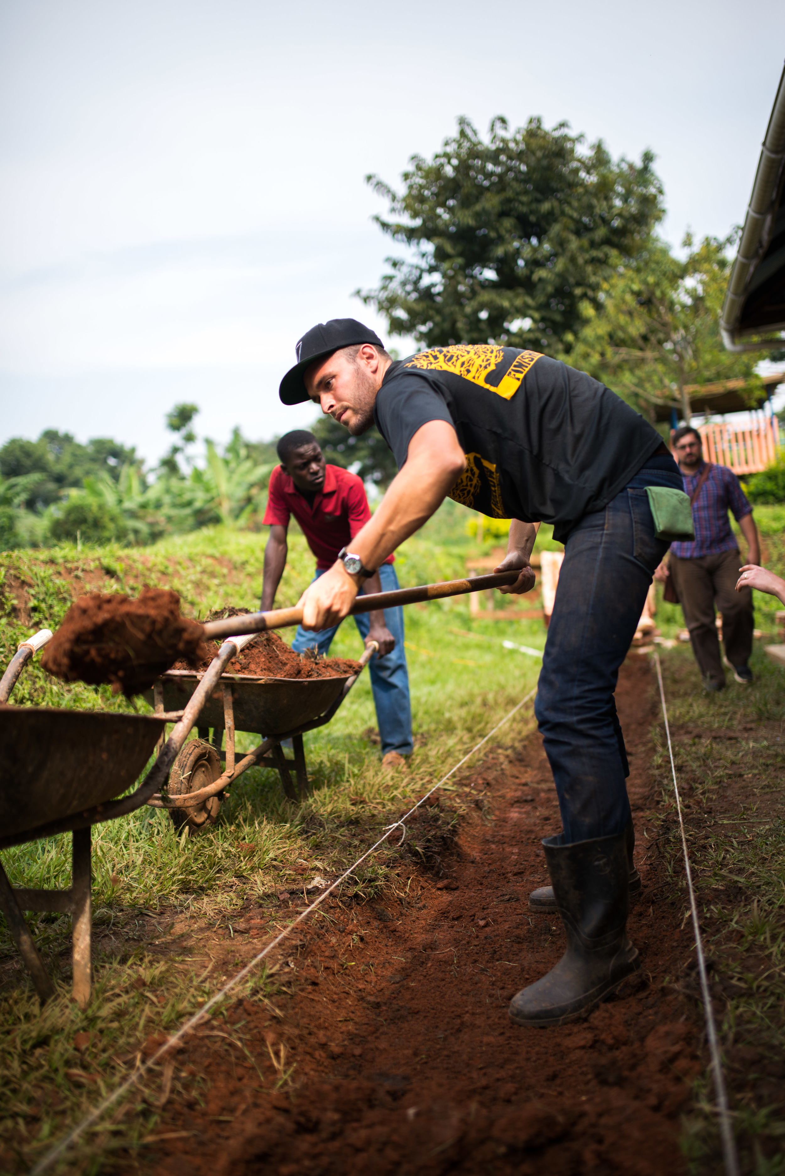 The men on the team were busy with a wide variety of projects that will help our land to become a safe and hospitable environment. Here, Ben Young creates a stone pathway for walking around the land so that far less mud is tracked inside of homes, a major problem in the rainy seasons. 