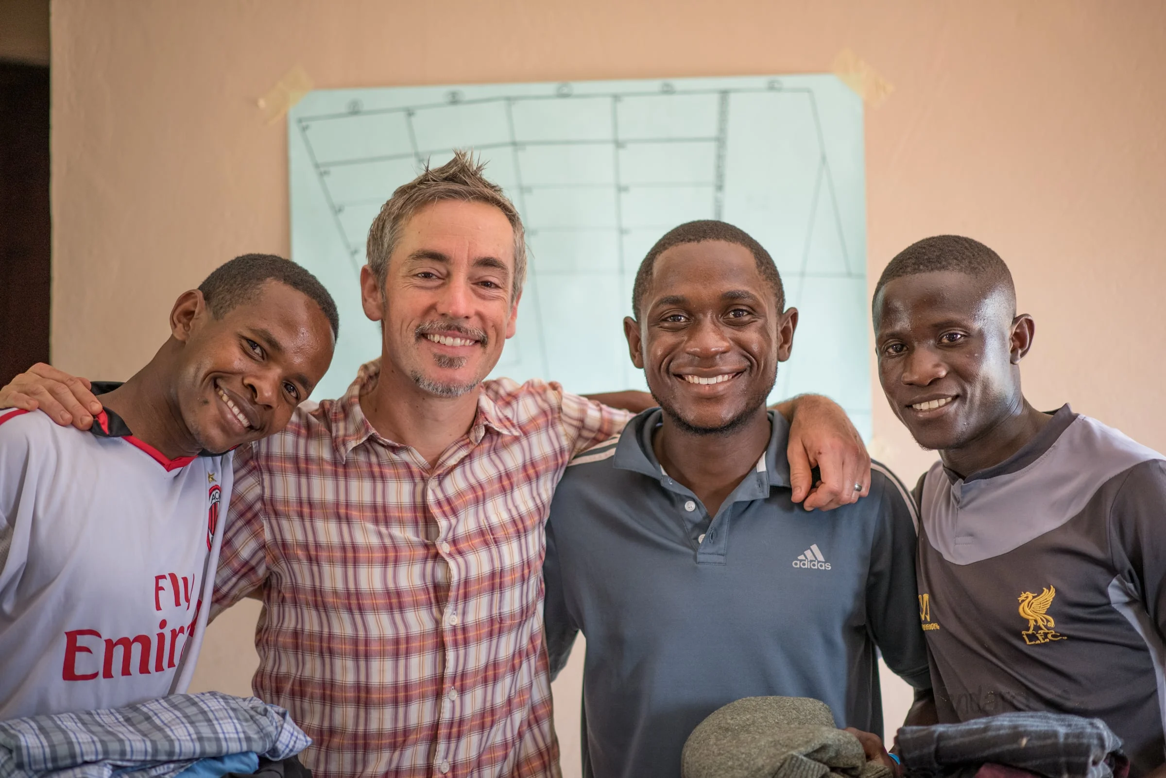 (L-R Simon Peter, Seth Davis, Andrew and Edwin) The bond formed between these men continues to grow. This was right before they set out to Uganda, after receiving several new pairs of work clothes. 
