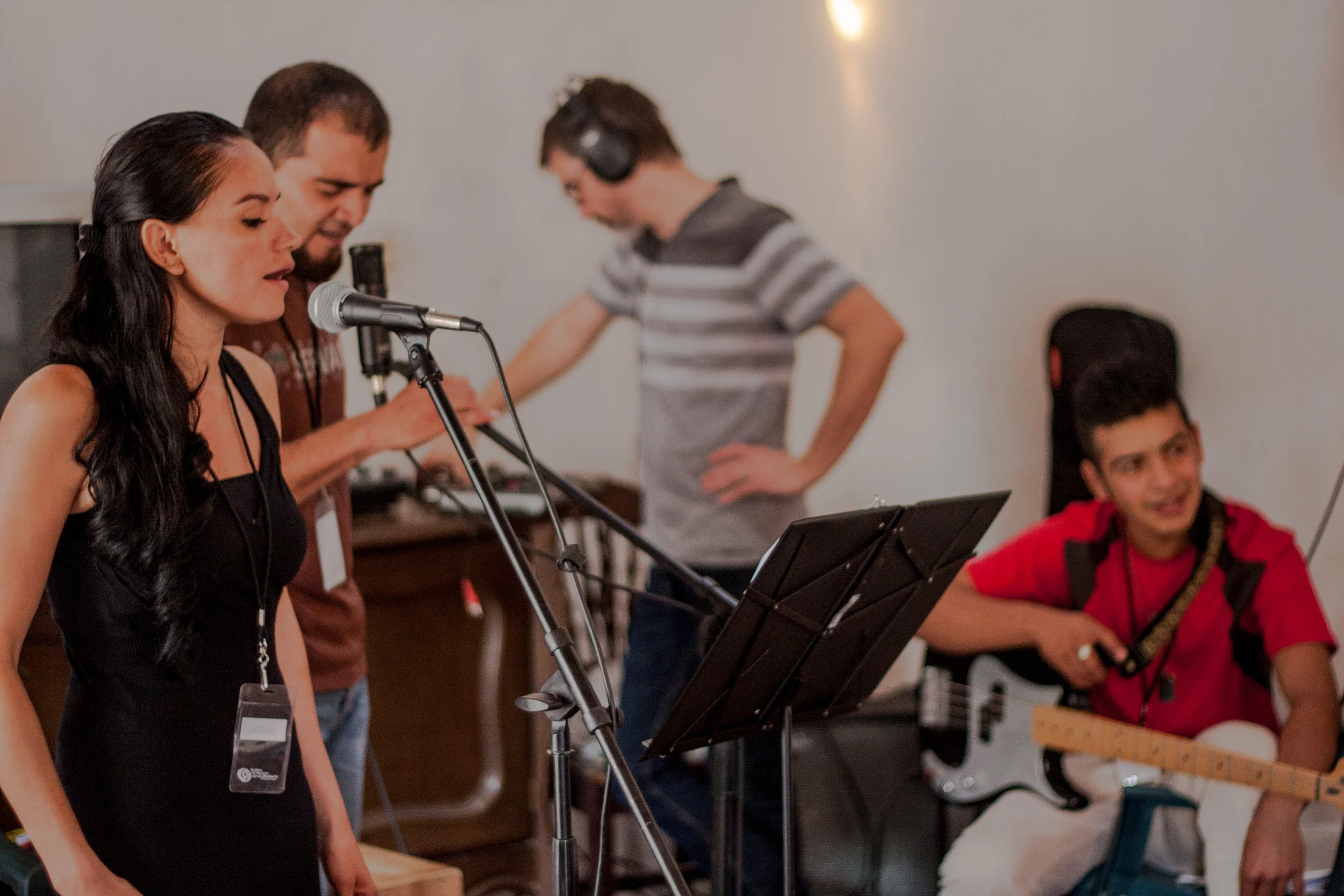 This winter, our team led worship alongside Lorena and Antonio (left). Britt Edwards (background) also helped the youth band record a few of their original songs. 