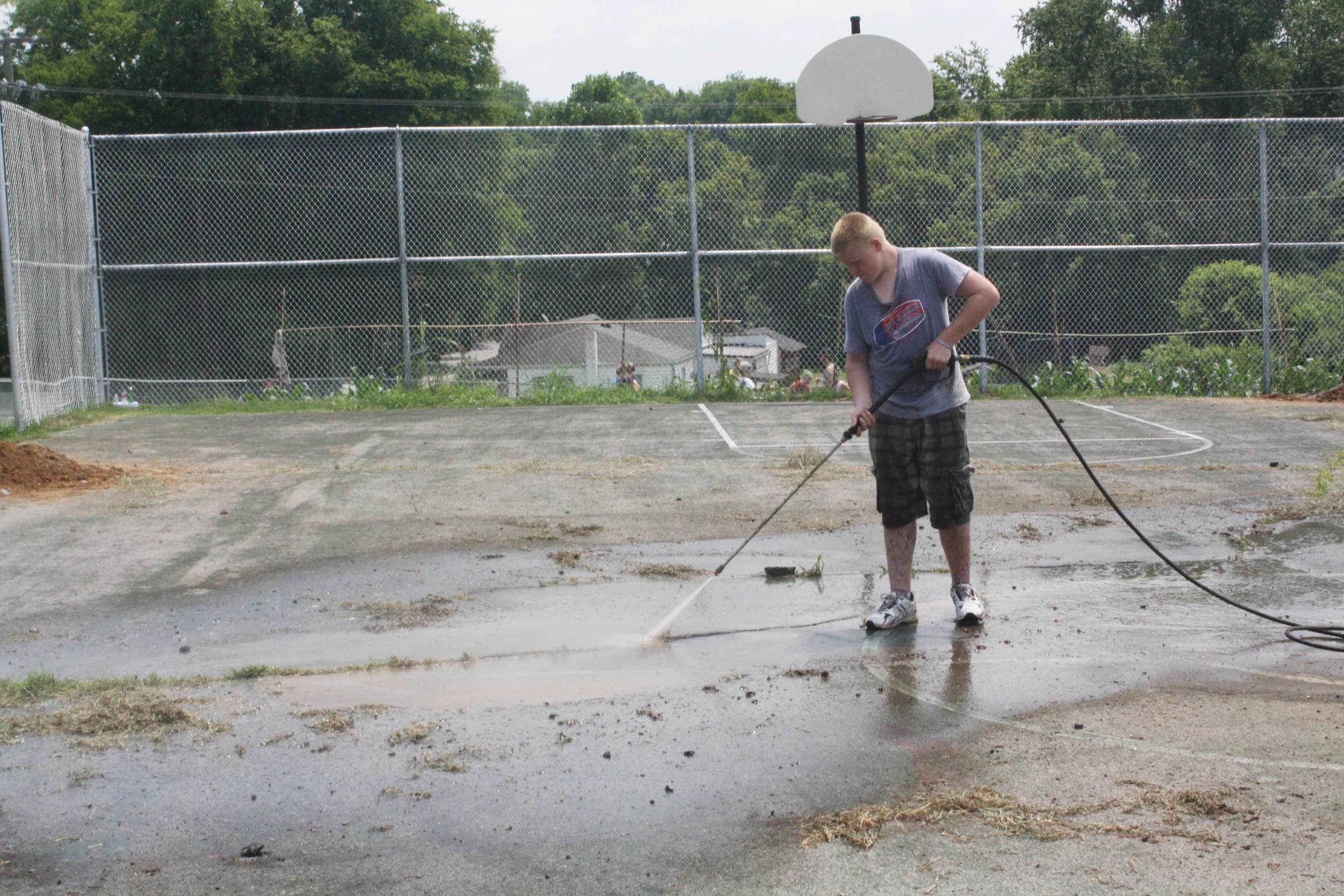 Volunteers helped resurface the basketball court after it had suffered years of neglect. 