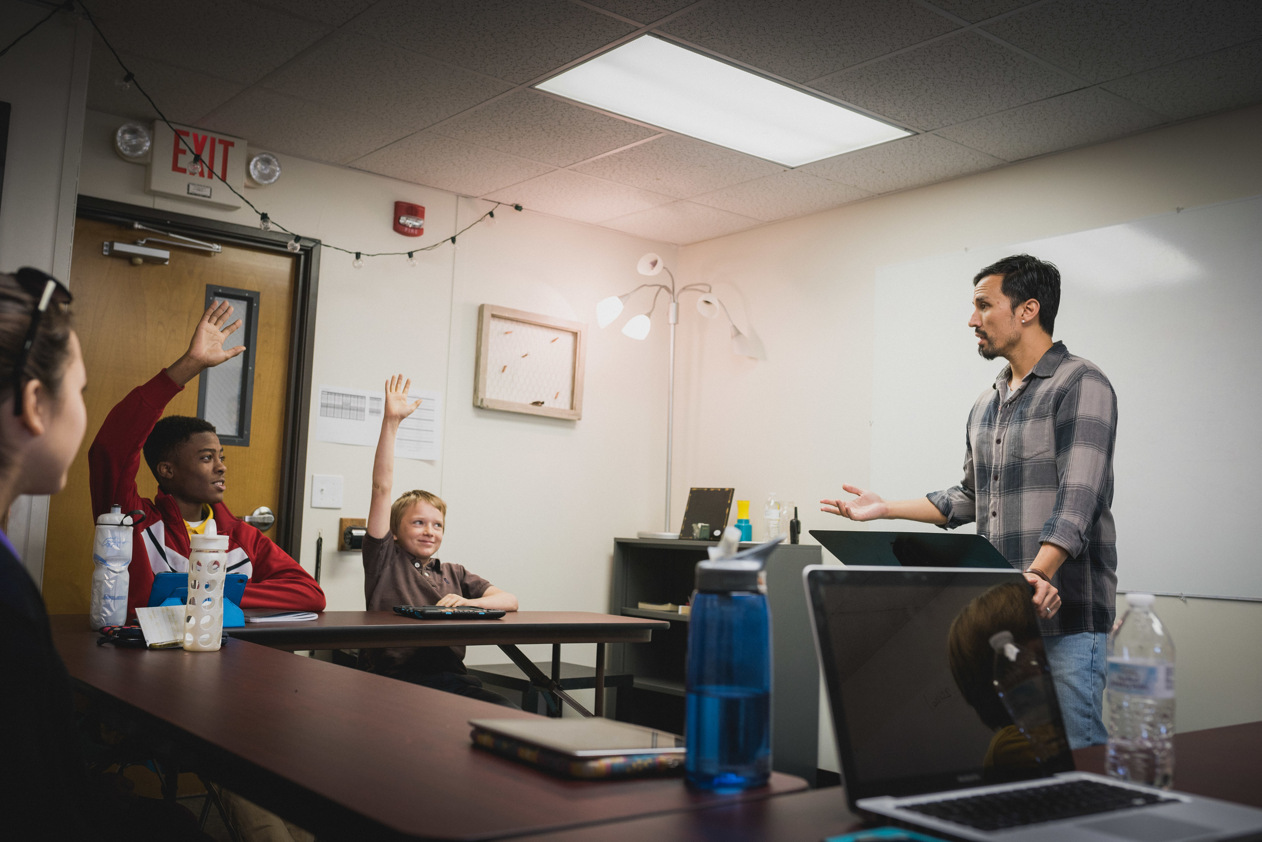 High School Bible teacher, Mr. Garner, guides his students through a character analysis presentation where they are challenged to practice critical thinking skills and effective communication.