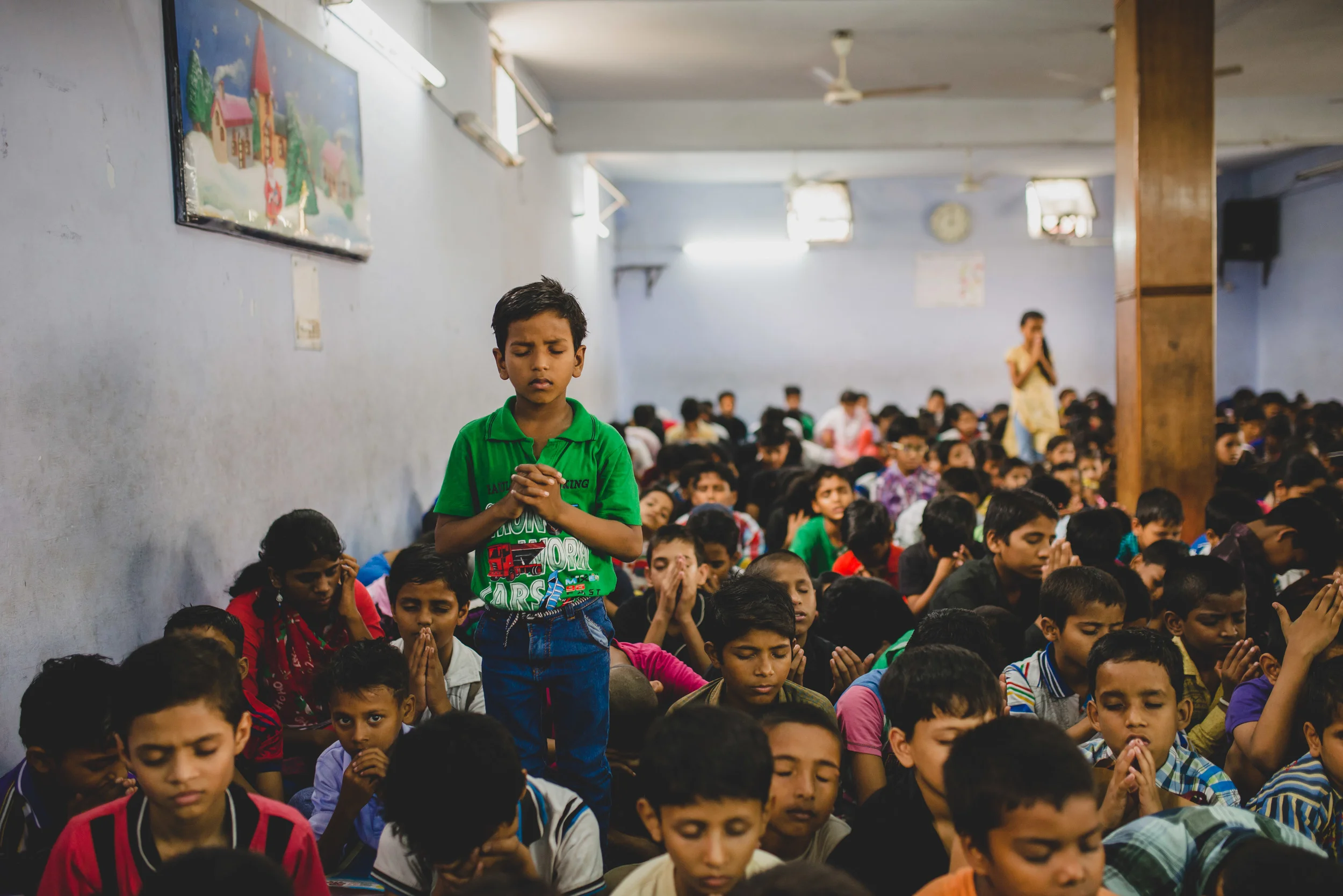 When we volunteered to help at a church's VBS we found 300+ children sitting on the floor in a non-air conditioned room for over 3 hours. There was no personal space, no accommodating seating, no temperature-controlled environment, and no hands-on activities. But those things did not prevent the children from expressing their love for God during a time of worship and prayer. Responding to the worship songs, some children rose to their feet while others fell to their knees. With eyes closed and hand clasped, the children poured out their prayers and praises to God.