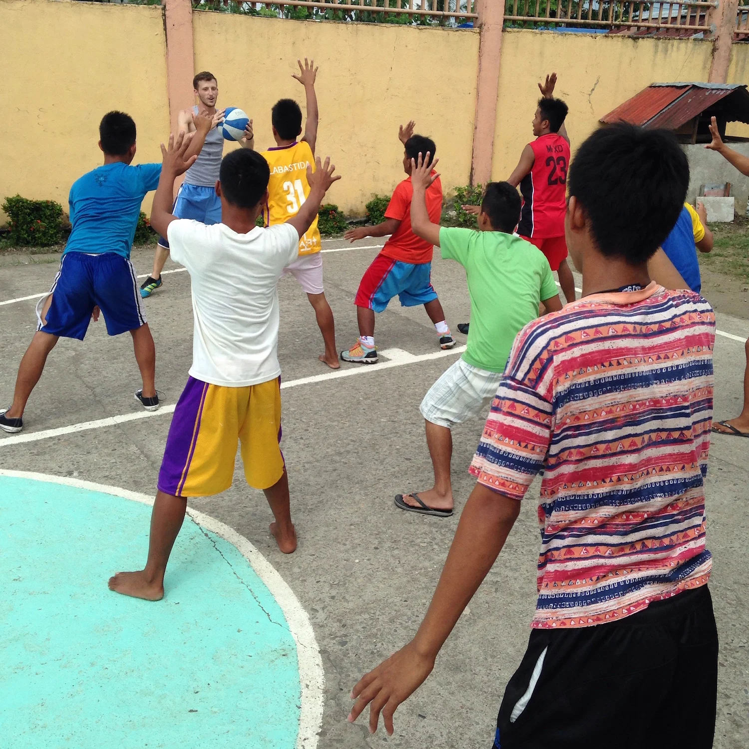 Clark Miller, South East Asia Team Member, hosts a basketball clinic for the youth at RRCY.