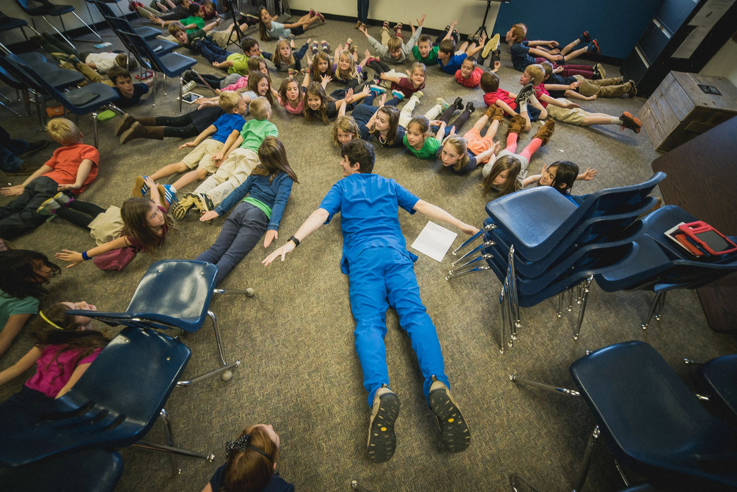 Local chiropractor Dr. Kevin Bradshaw visited to teach students exercises about good posture and total body health. Because the iPad is our primary manipulative, we teach students how to guard against future neck and back pain due to bending over a screen. Students loved the interactive session with Dr. Bradshaw, and many homerooms began faithfully practicing the exercises each morning!