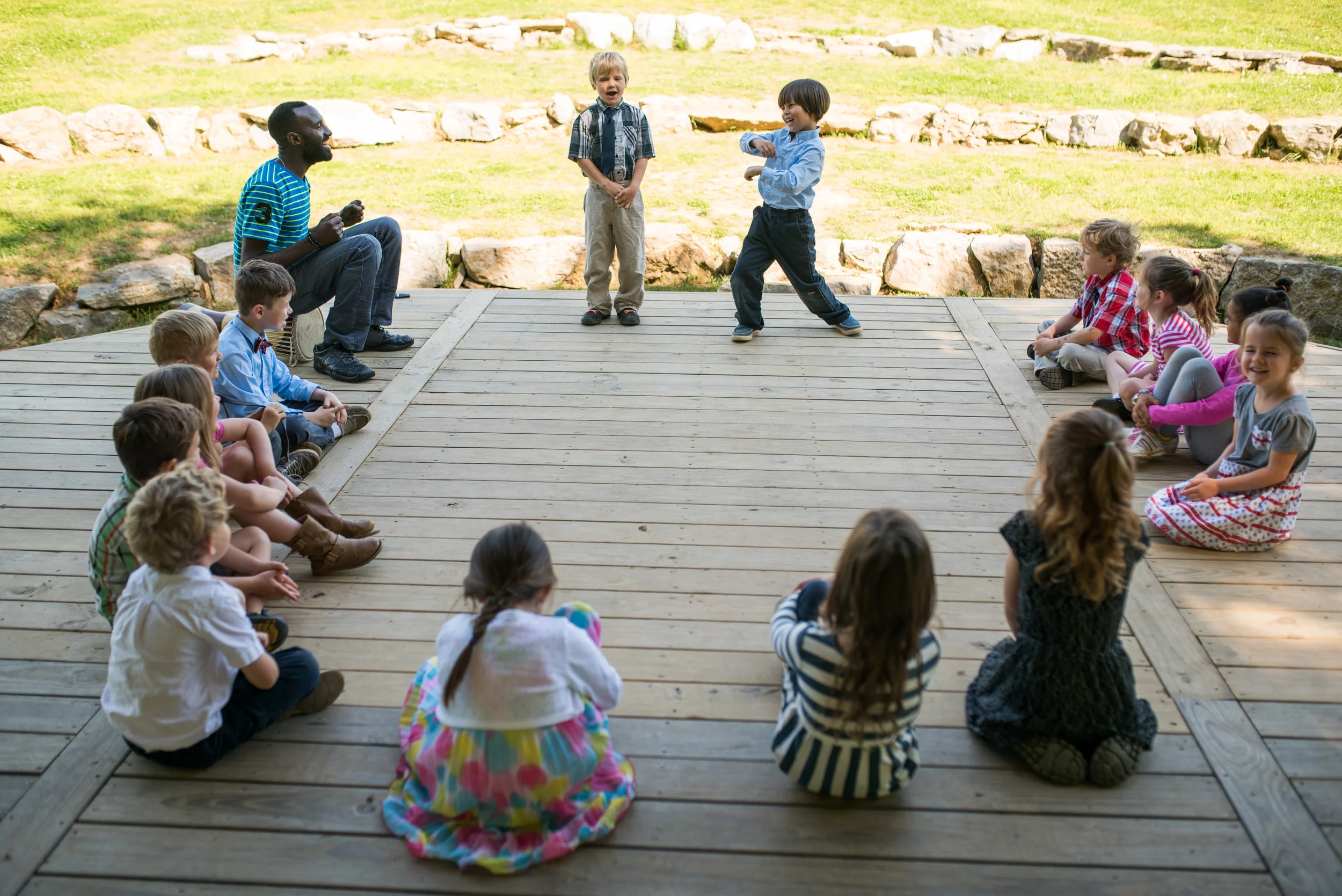 Every Wednesday Kindergarteners enjoyed ‘Songs’ class, a time to learn new worship songs, and explore rhythm and dance! Here Mr. Nyago, originally from Uganda, led a dance circle, providing a steady beat on his drum and coaching students on their movement.