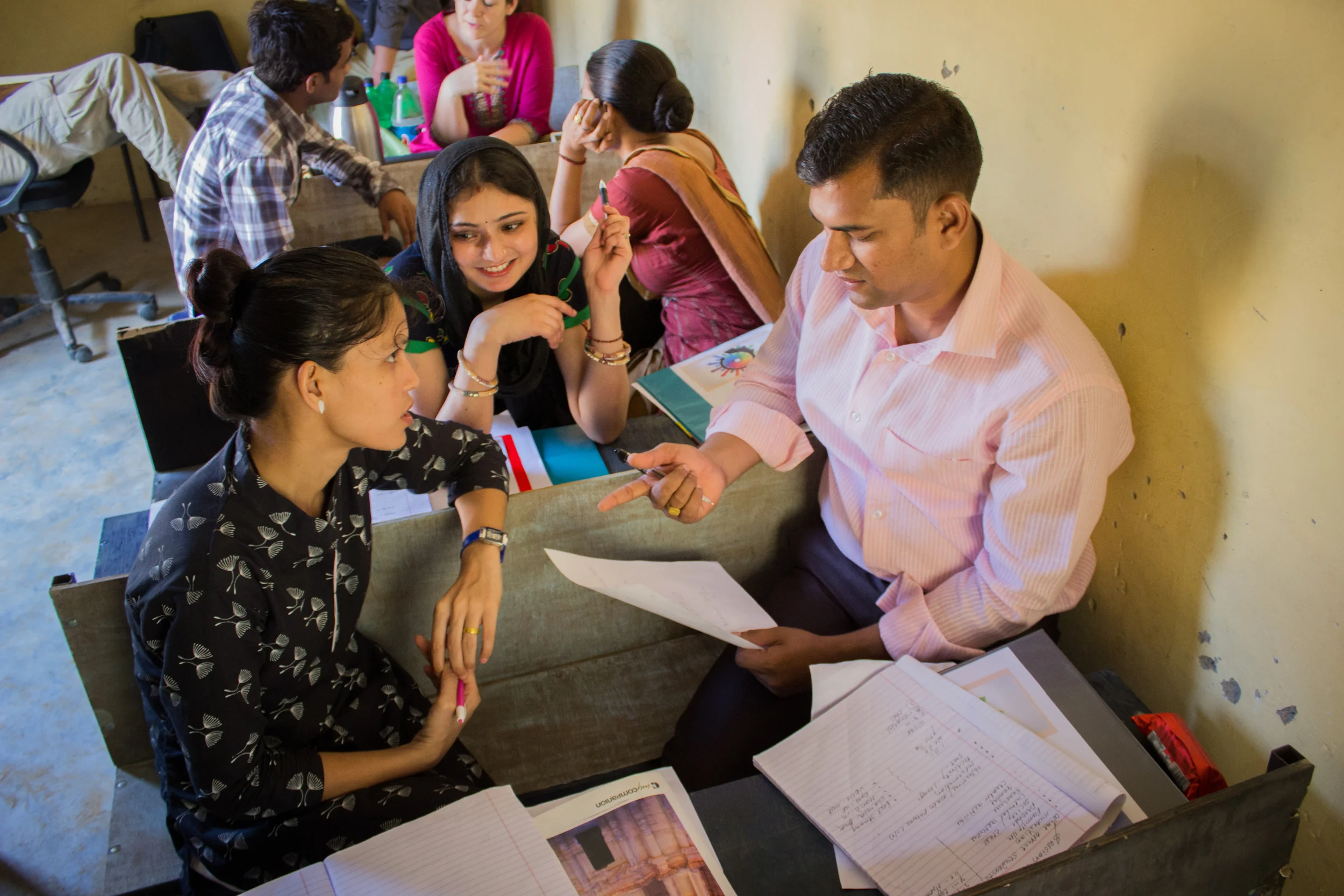 Teachers work together during one of the seminar activities to brainstorm ideas for classroom management. One teacher commented, "I learned how to improve my interaction with the children, to be more playful and help them feel safe to share in the class."