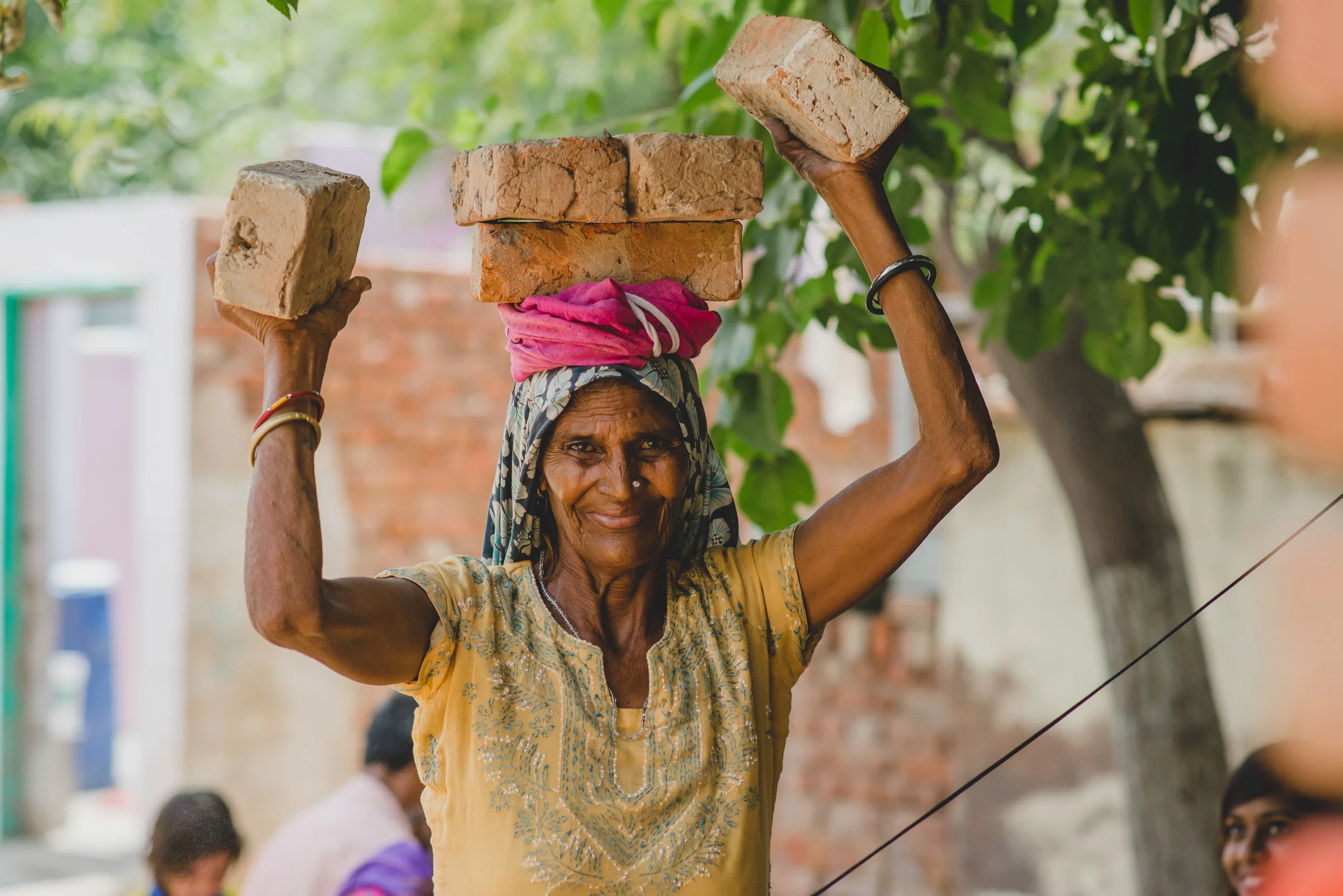“I do all the inside work and all of the outside work. I am not scared of work. I work harder than many of these younger women." We witnessed the truth of these words as we watched her clean, cook, collect water, and care for both her grandchildren and neighboring children. Her advanced years did not exempt her the strenuous tasks of gathering wood or carrying bricks.
