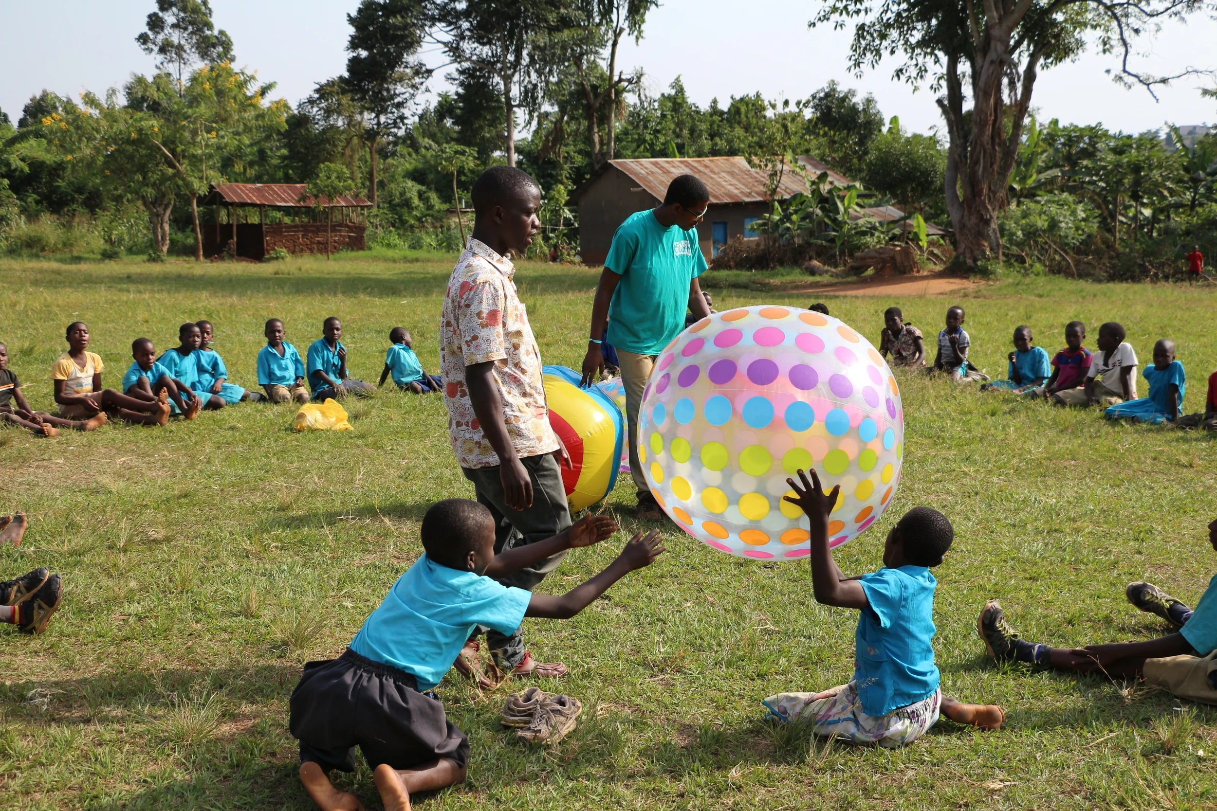 Brian helps facilitate a recreational activity during recess with our summer interns for the children at St. John's Primary School, where he teaches during the week. 