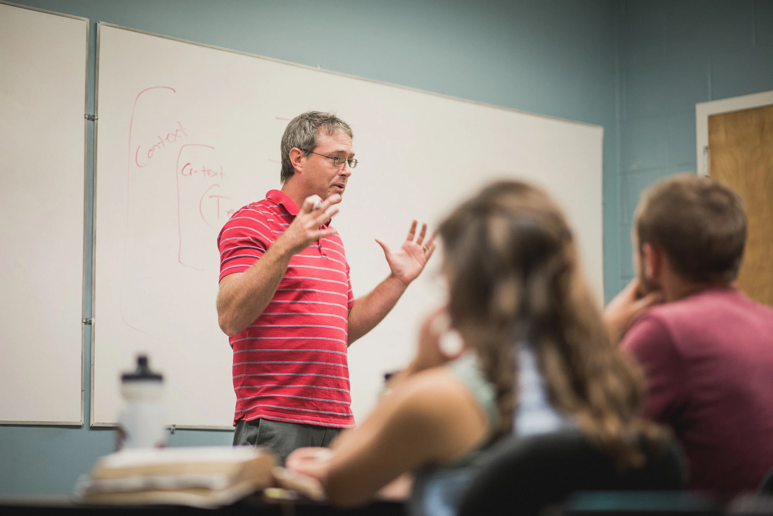 After teaching Institute classes during the day, Shaun Galford volunteers his time to teach a neighborhood Bible study in the evenings each week. 
