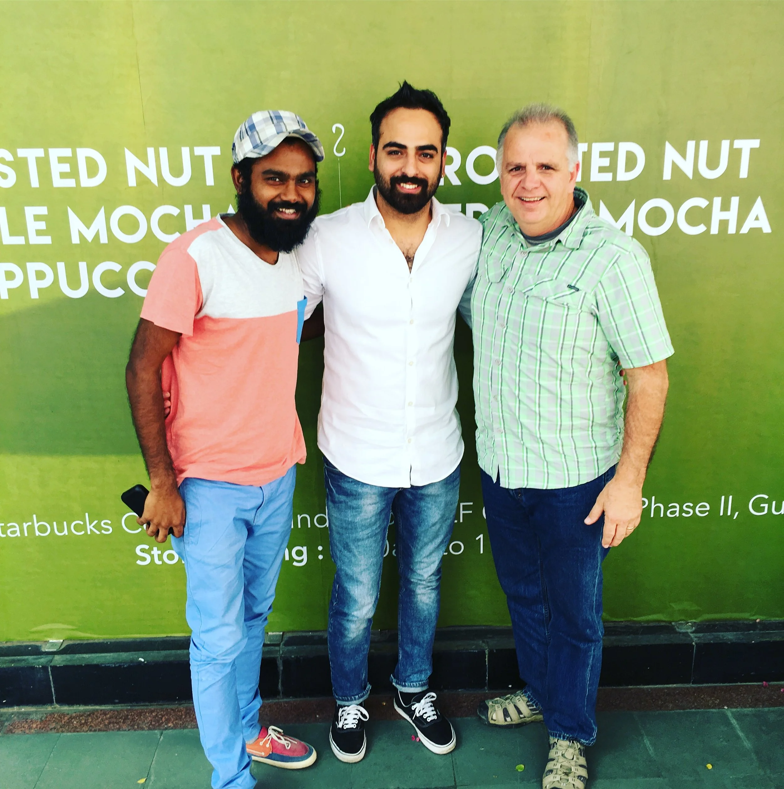 Manohar (left) and Scott (right) meet with Ram (center), a business consultant to discuss job creation in the area. 