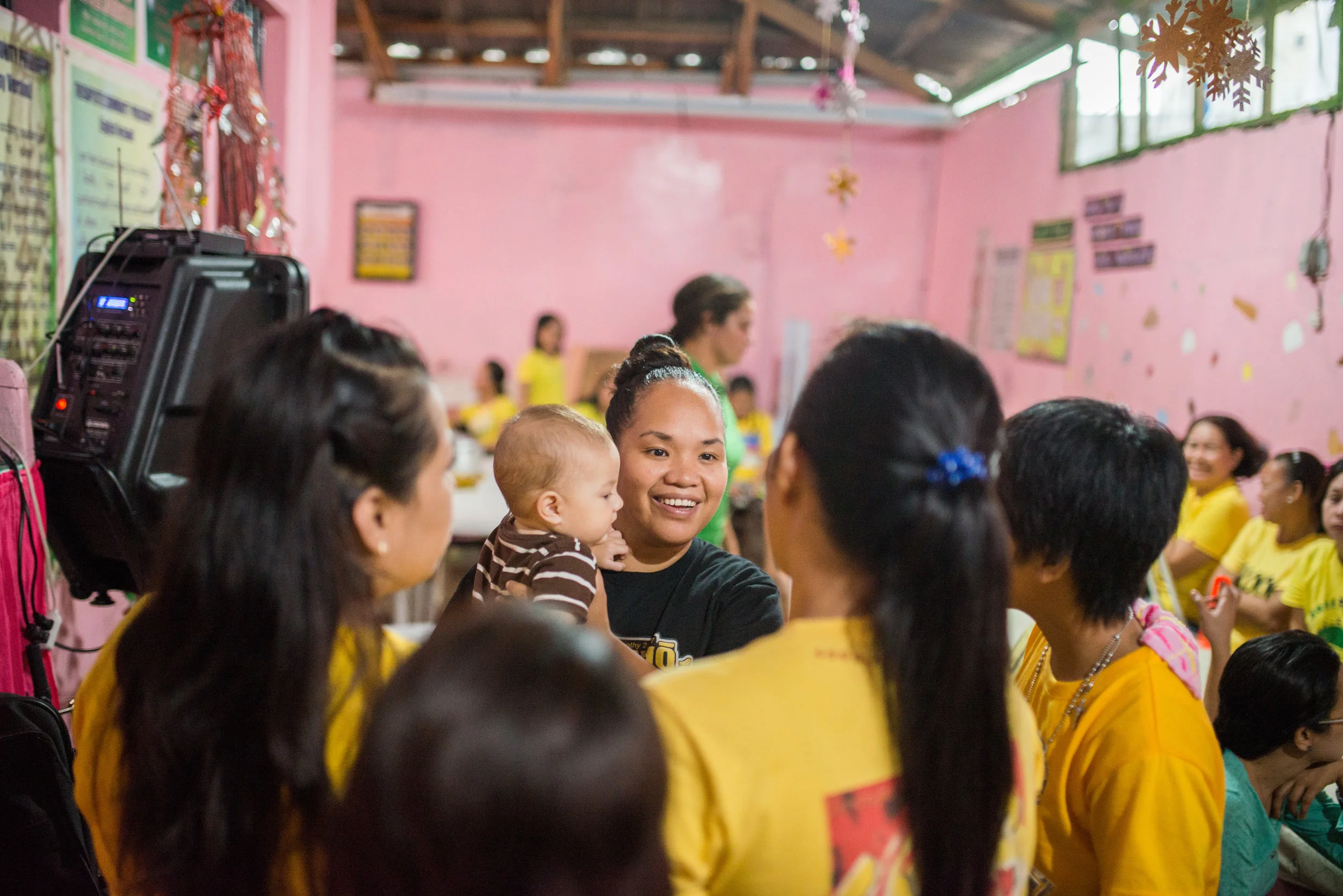 Team member Rina Miller visits with the ladies at the Tacloban City prison after a time of encouragement. 