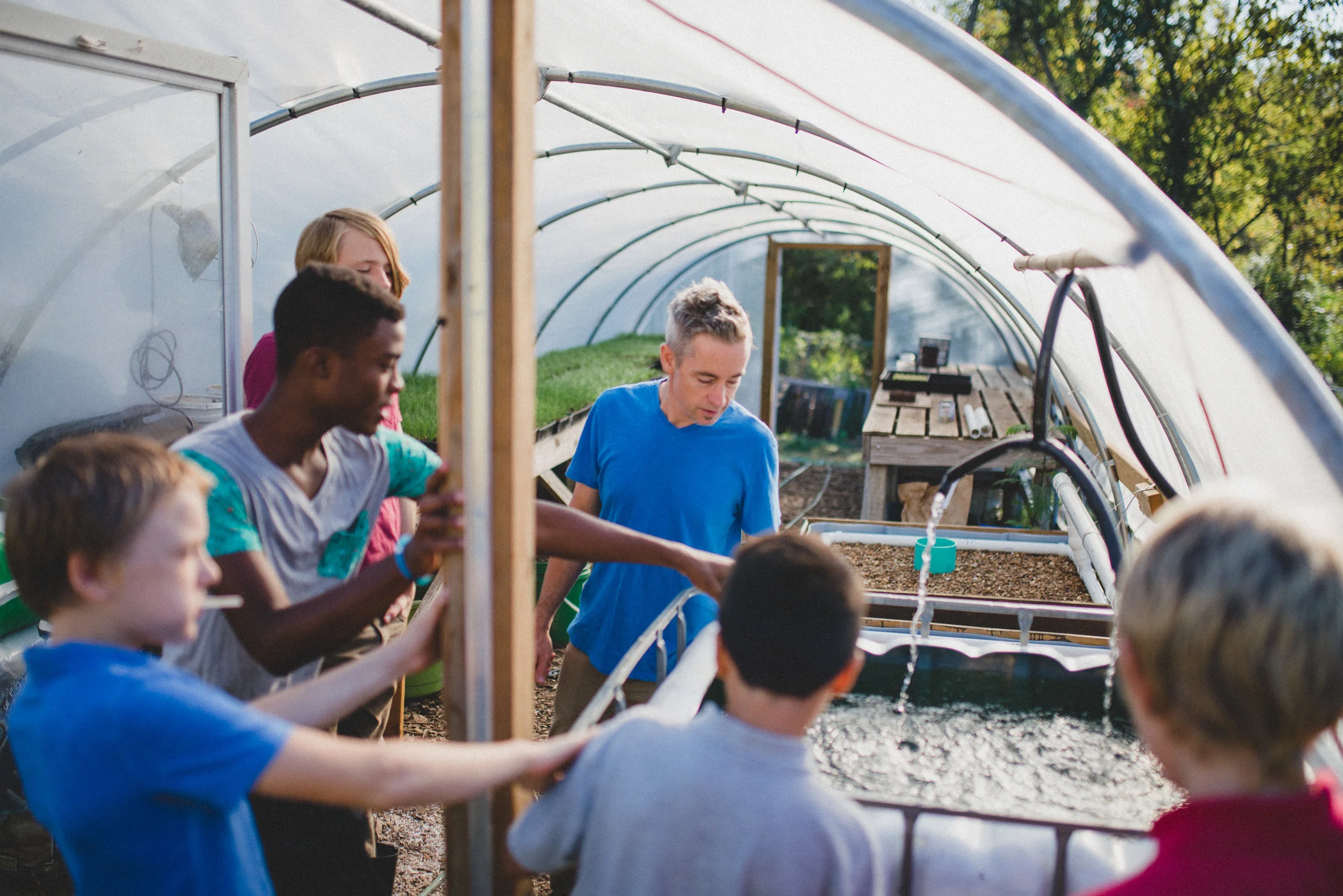 Junior high and high school students at the Academy for G.O.D. helped design, build and implement an aquaponics system at Hopewell Gardens. Nutrient-rich water produced by fish in the tank is transferred to assist in the growth of plant life in the garden. Watching the students take on ownership for an innovative project was truly awesome. 