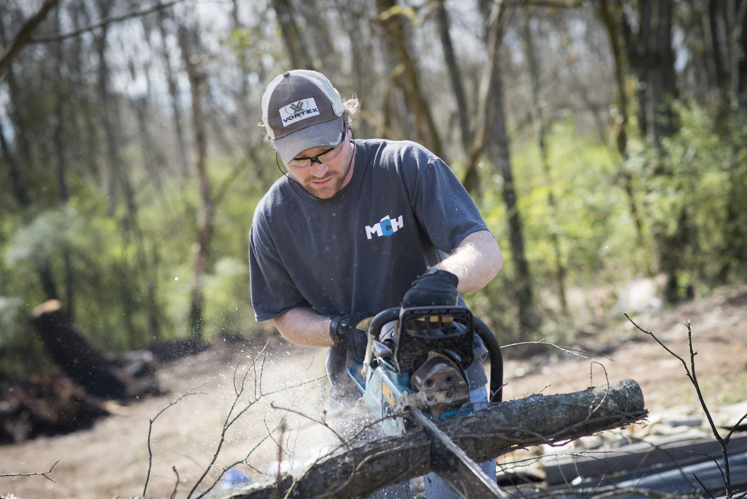Kyle Becker, who was known as 'most likely to become a lumberjack' in high school, now uses his tree-chopping skills to aid in clearing the land behind our property. There is no shortage of opportunities to provide volunteer labor around our property, where we are always growing, expanding, and changing to best fit how we serve those in need. 